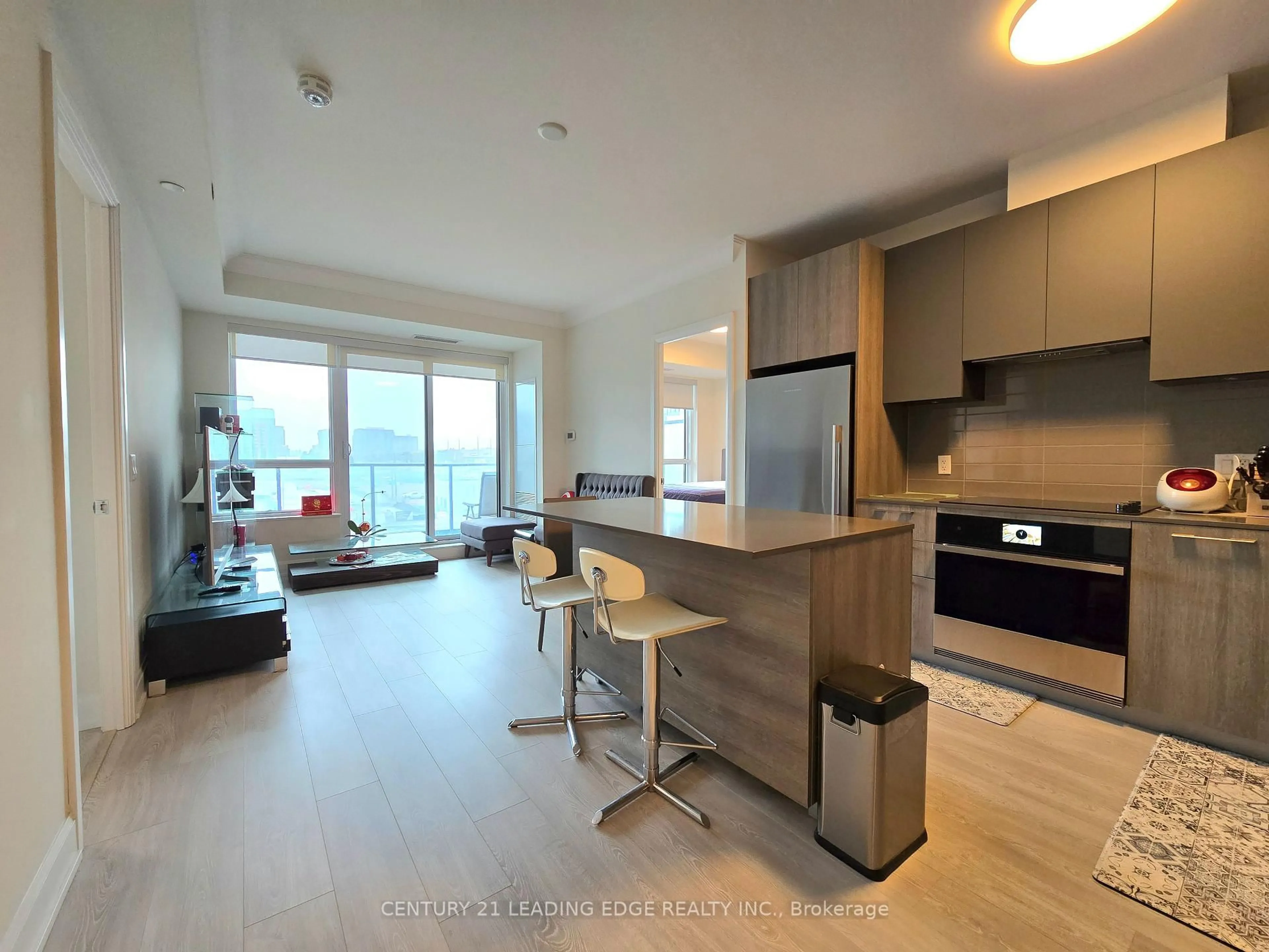 Open concept kitchen, wood/laminate floor for 18 Water Walk Dr #506, Markham Ontario L3R 6L5