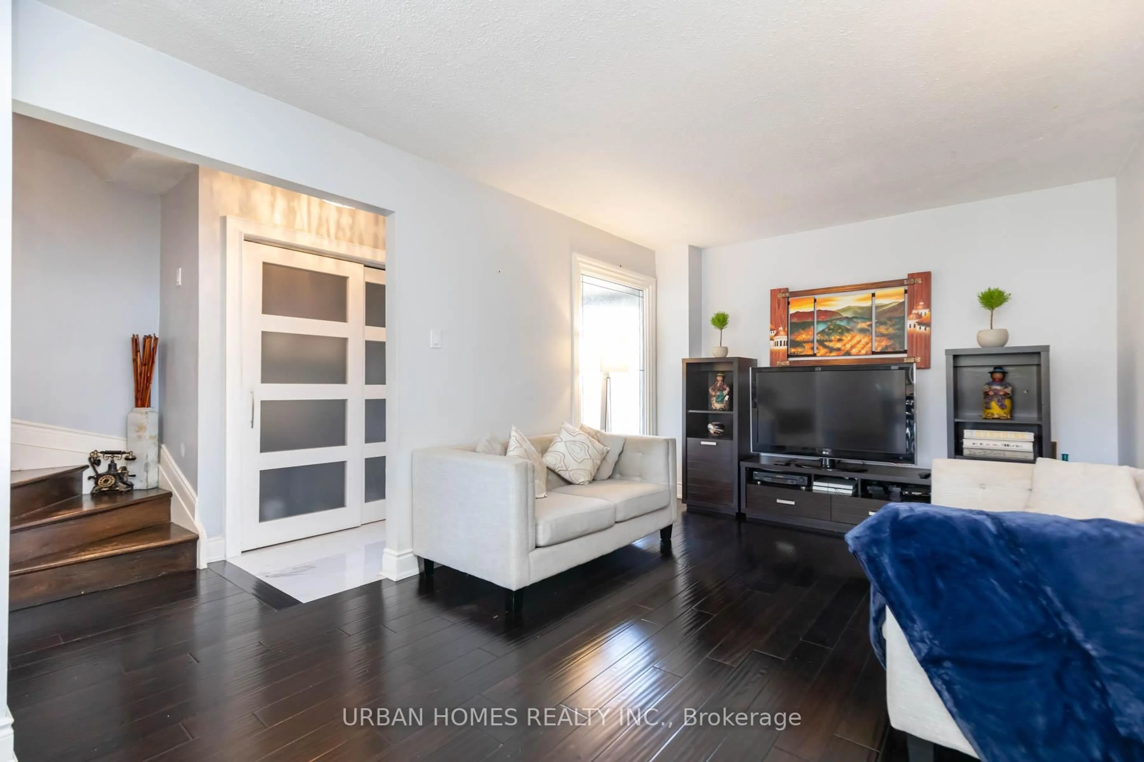 Living room with furniture, wood/laminate floor for 61 bob o'link Ave, Vaughan Ontario L4K 1H2
