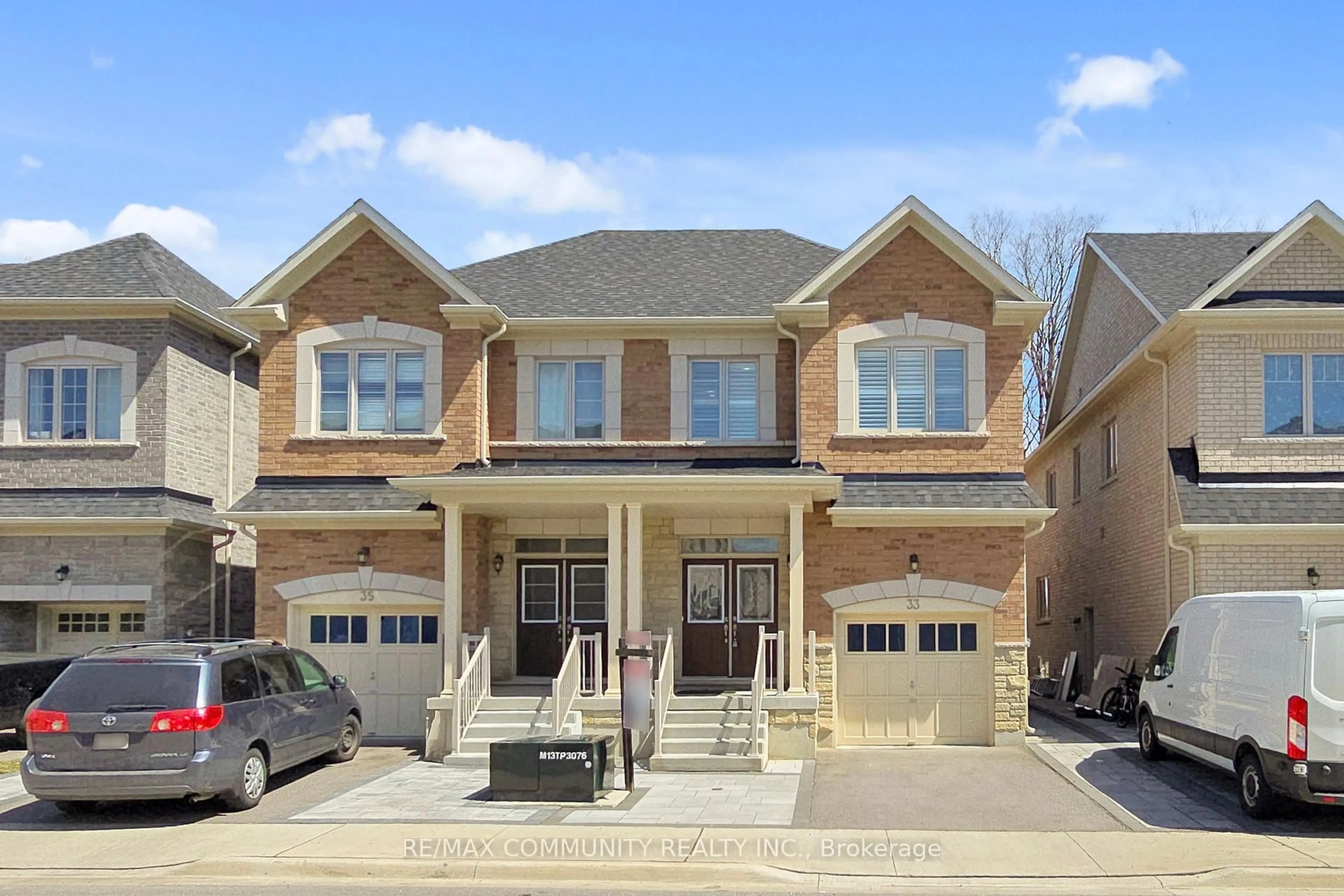 Home with brick exterior material, street for 33 Erintol Way, Markham Ontario L3S 0E6