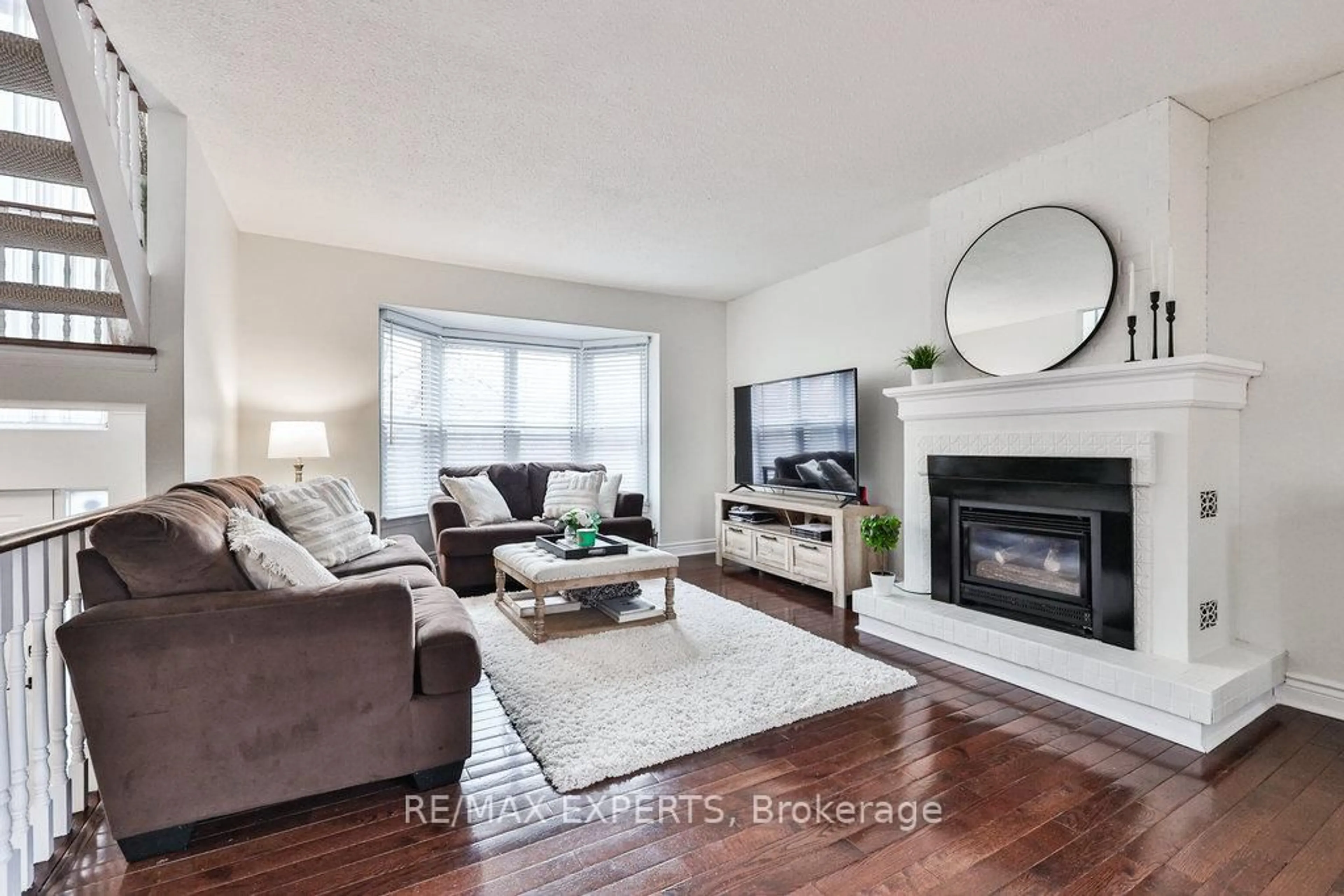 Living room with furniture, wood/laminate floor for 4 Amos Maynard Circ, Vaughan Ontario L4L 3B8