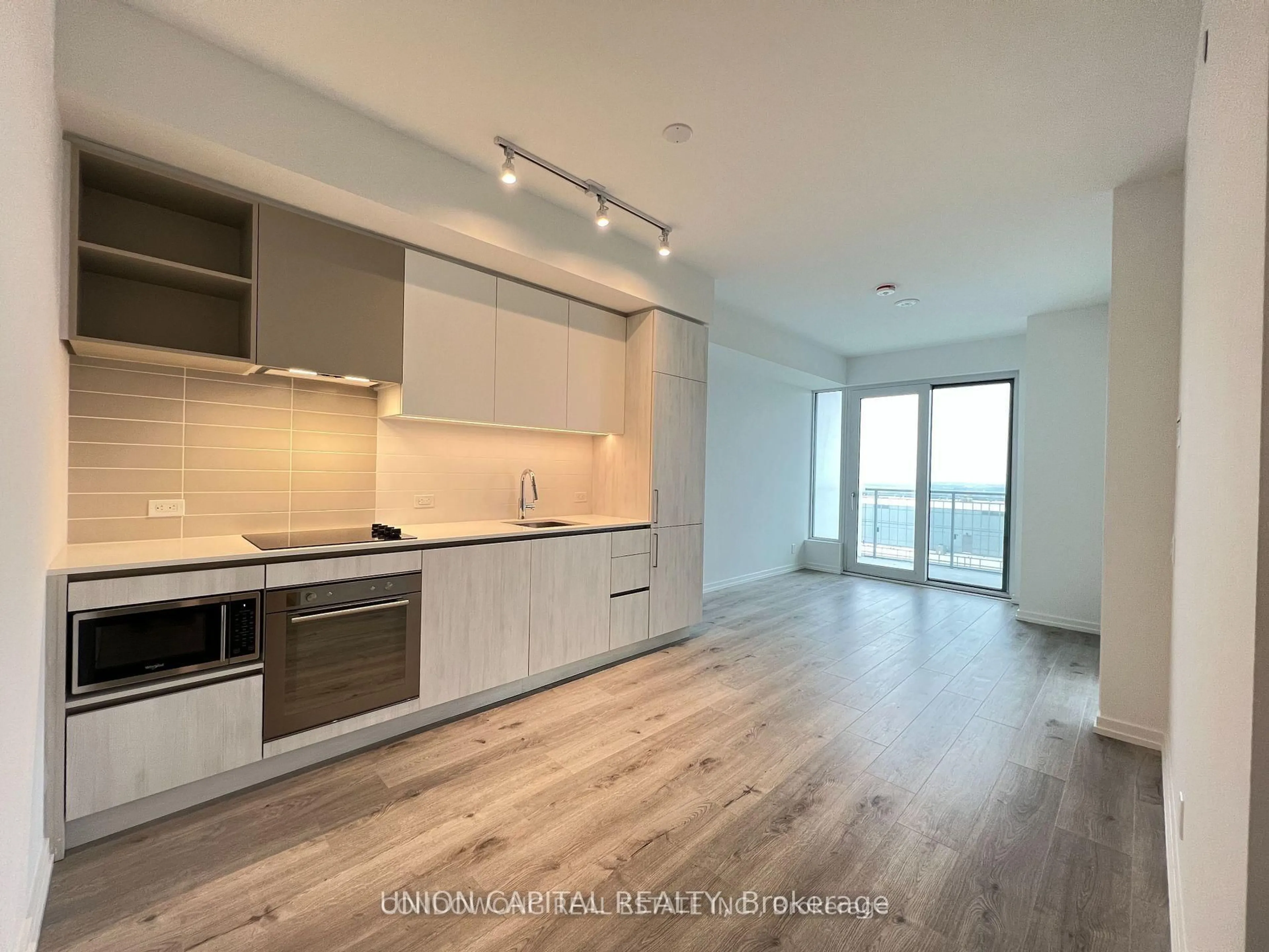 Open concept kitchen, wood/laminate floor for 7890 Jane St #4311, Vaughan Ontario L4K 0K9