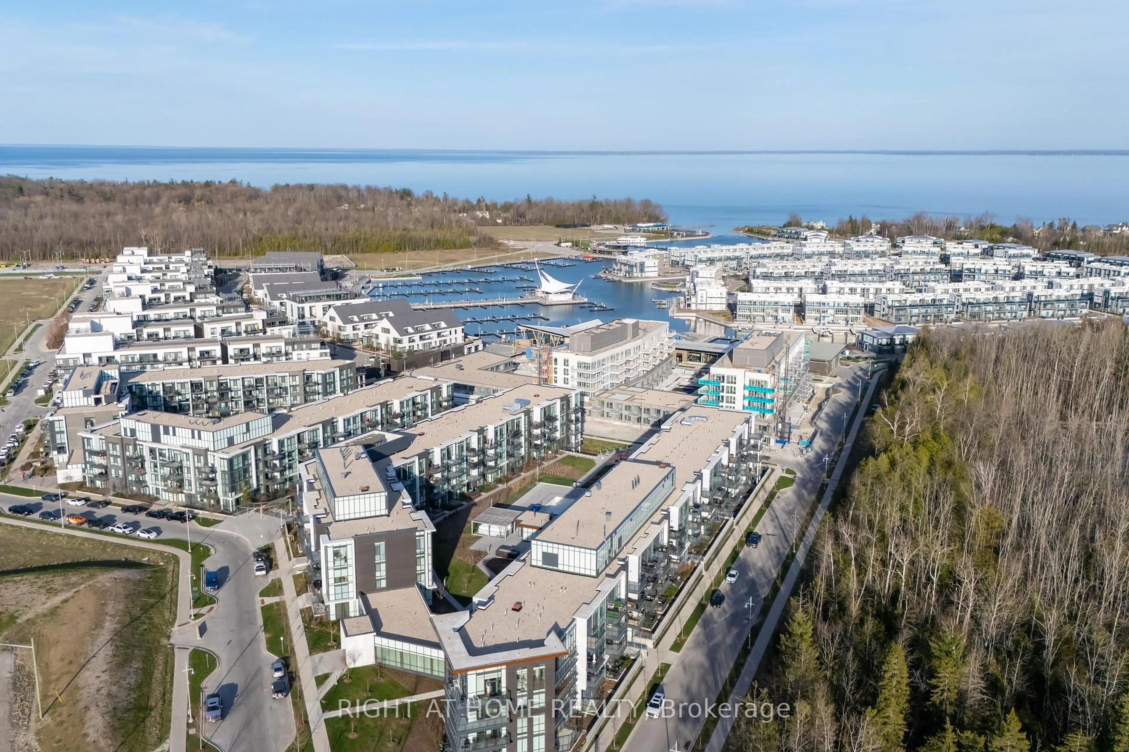 A pic from outside/outdoor area/front of a property/back of a property/a pic from drone, water/lake/river/ocean view for 415 Sea Ray Ave #202, Innisfil Ontario L9S 0R5