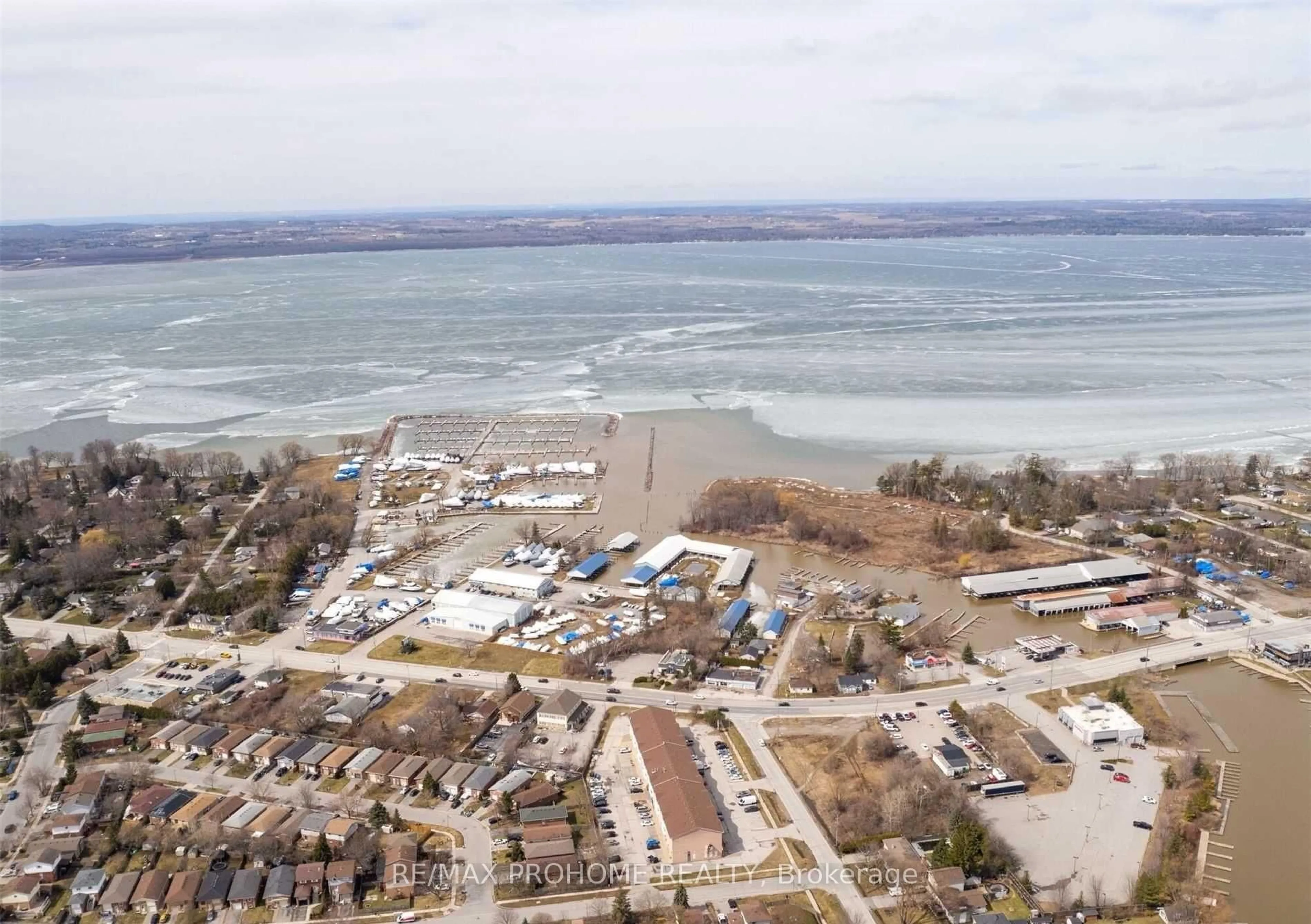 A pic from outside/outdoor area/front of a property/back of a property/a pic from drone, water/lake/river/ocean view for 102 Riveredge Dr, Georgina Ontario L4P 2P1