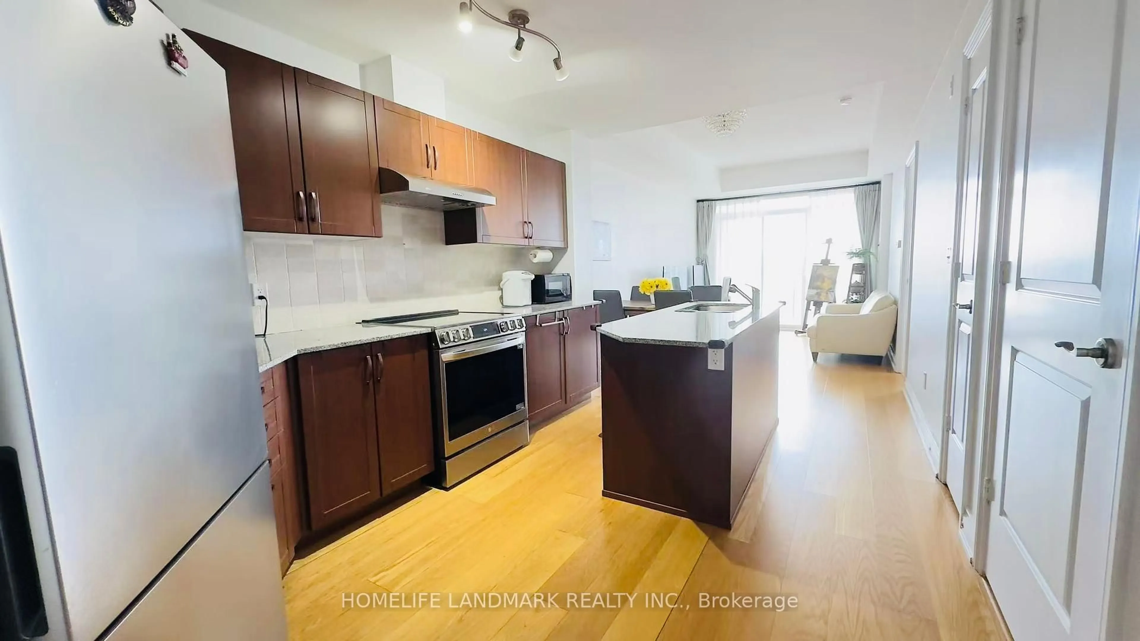 Open concept kitchen, wood/laminate floor for 68 Main St #501, Markham Ontario L3P 0N5
