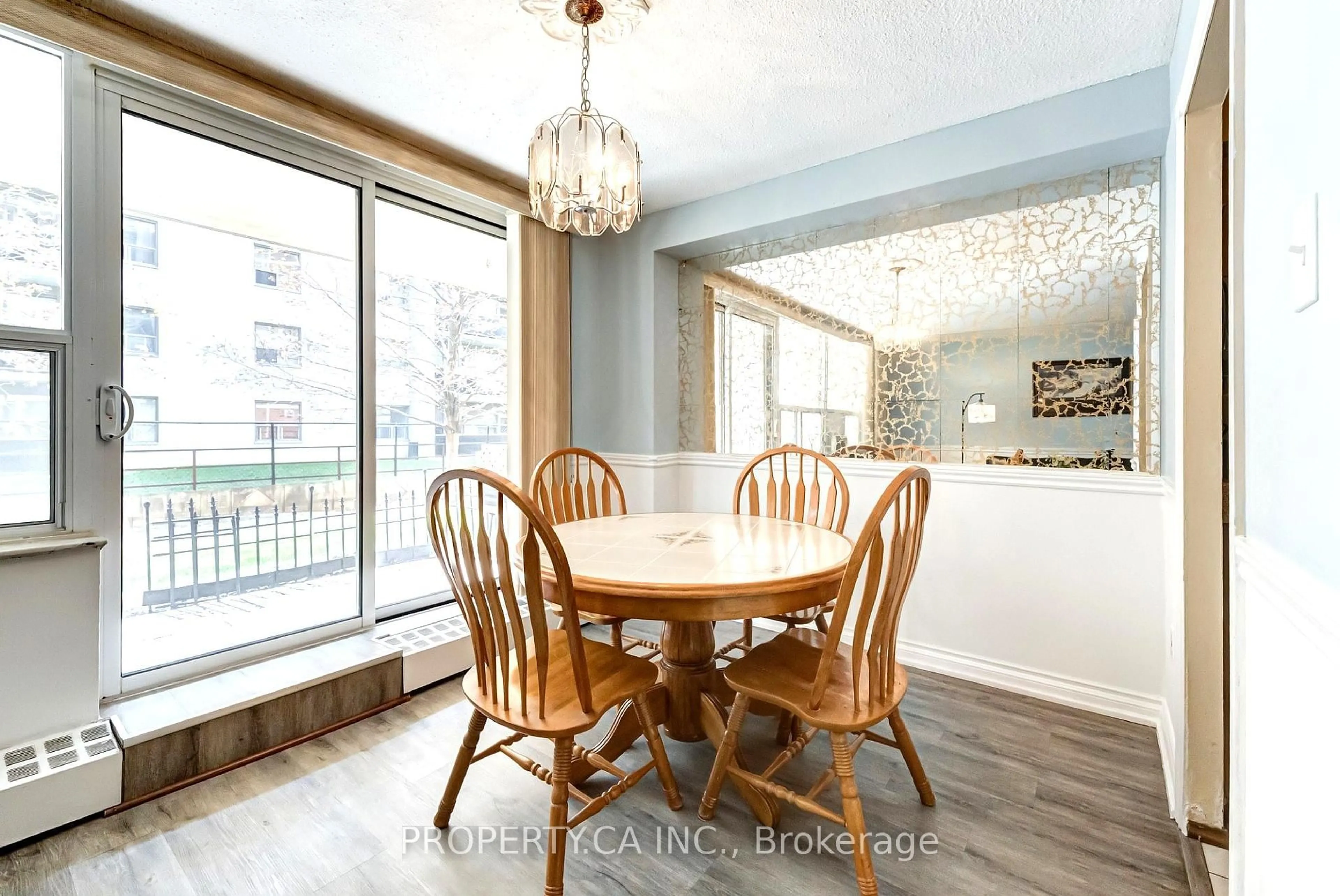 Dining room, wood/laminate floor for 180 Dudley Ave #104, Markham Ontario L3T 4X2