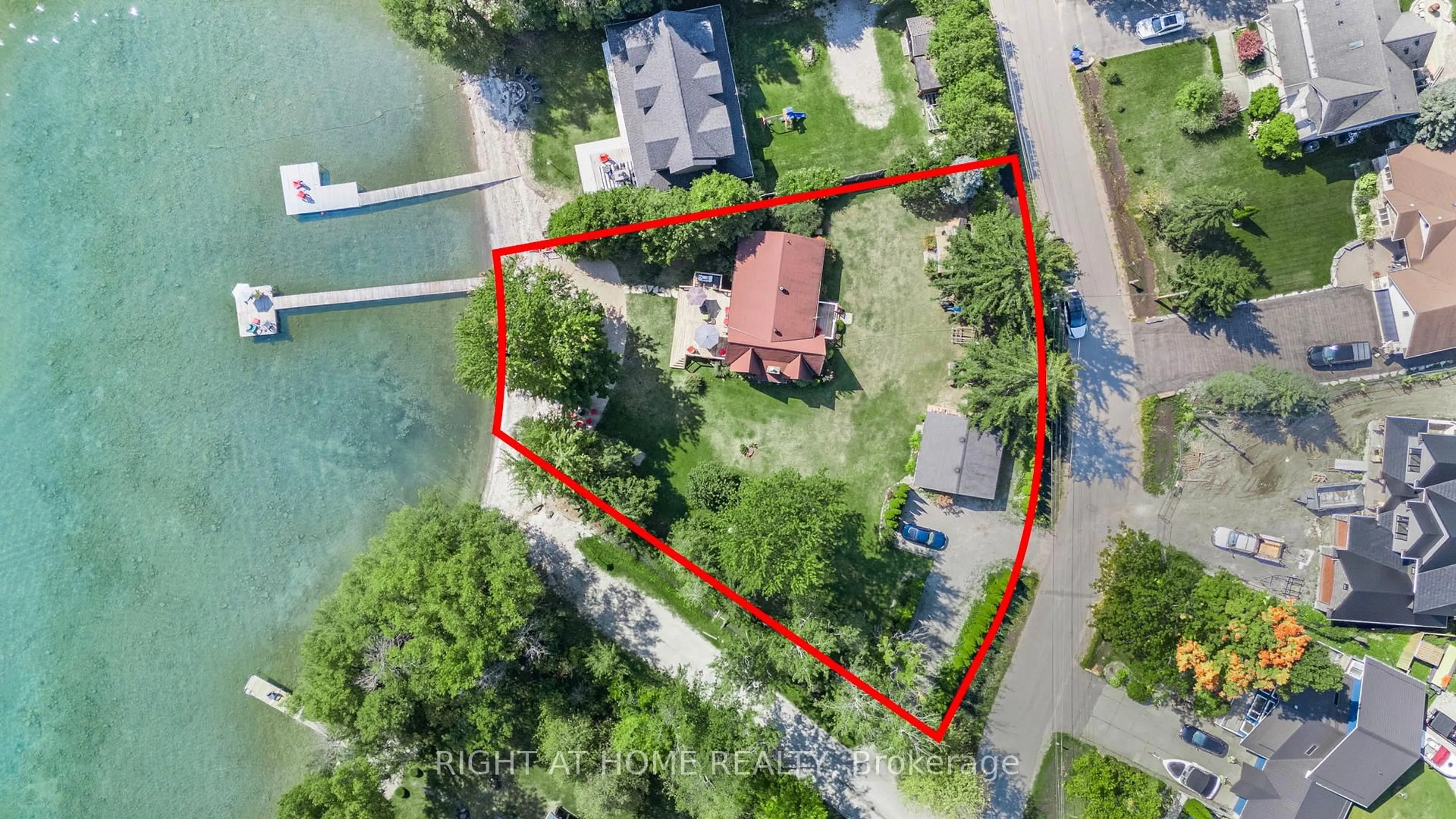 A pic from outside/outdoor area/front of a property/back of a property/a pic from drone, water/lake/river/ocean view for 113 Minnetonka Rd, Innisfil Ontario L9S 2V8