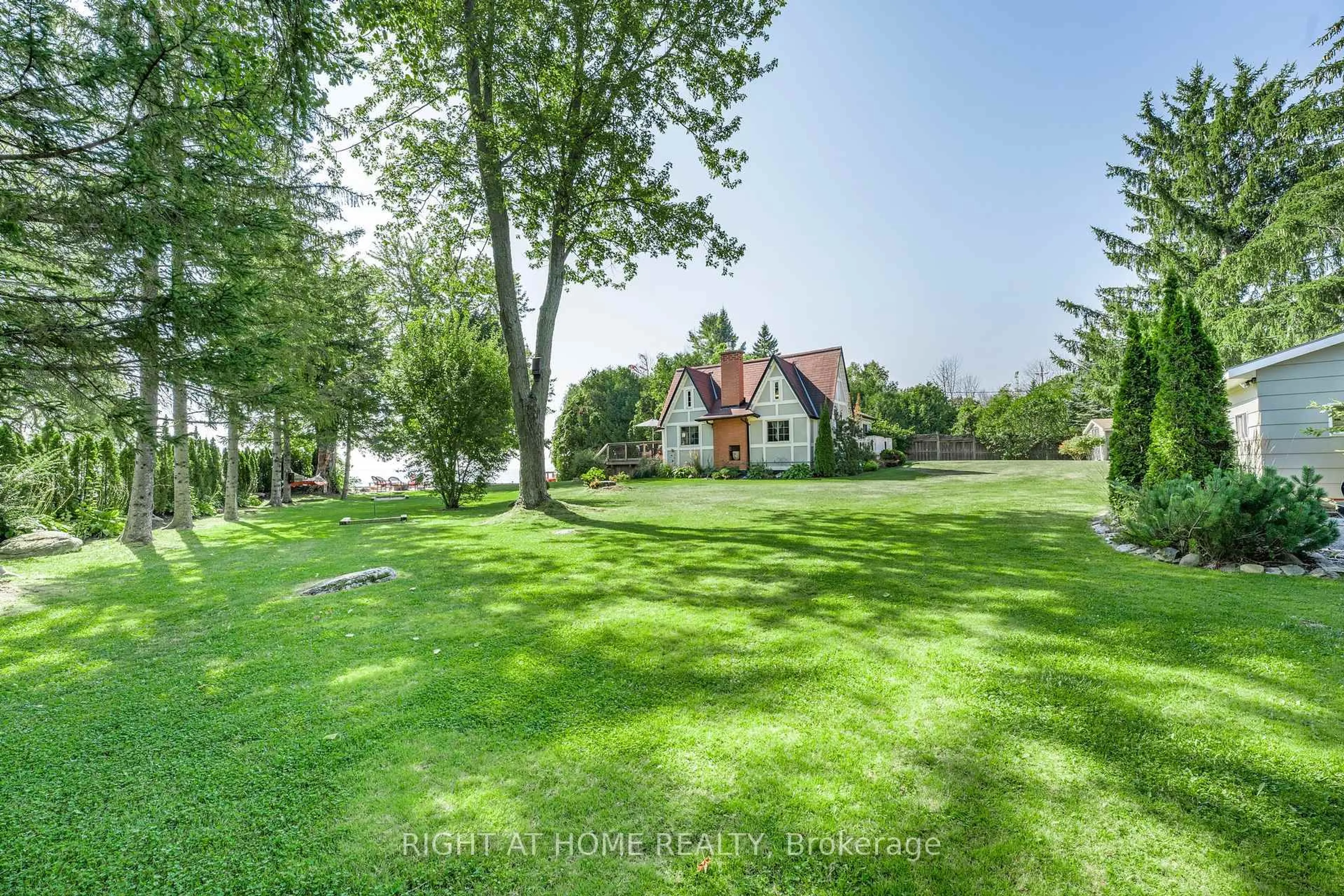 A pic from outside/outdoor area/front of a property/back of a property/a pic from drone, water/lake/river/ocean view for 113 Minnetonka Rd, Innisfil Ontario L9S 2V8
