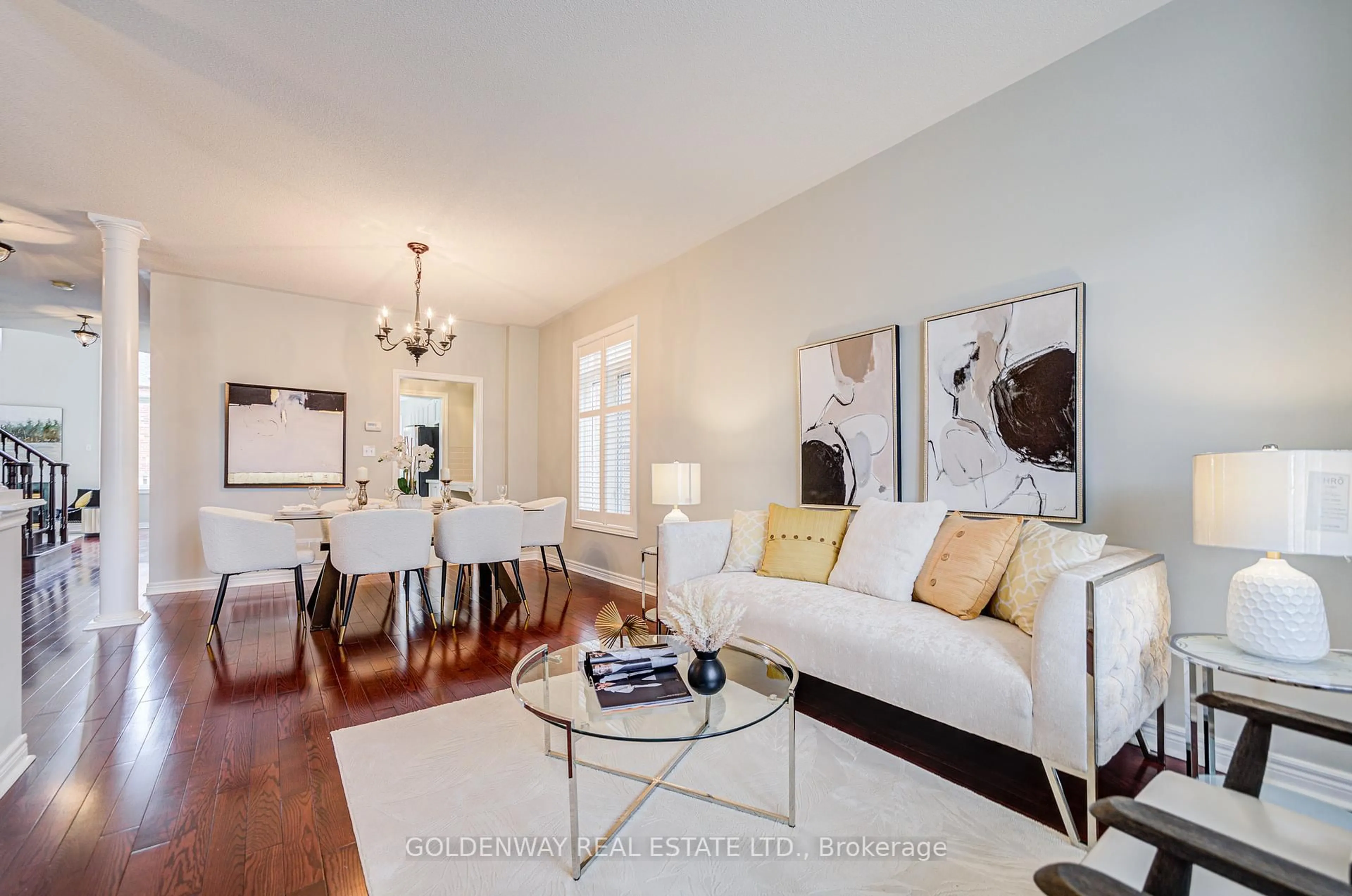 Living room with furniture, wood/laminate floor for 47 Victoria Wood Ave, Markham Ontario L6E 1K2