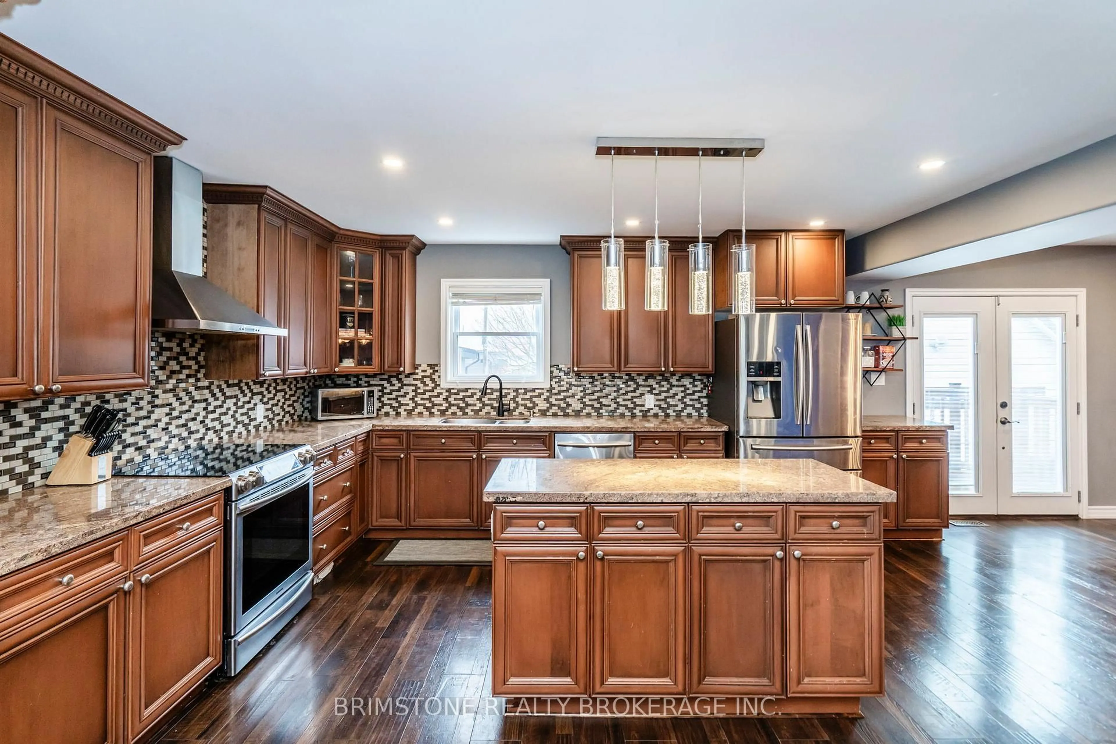 Open concept kitchen, ceramic/tile floor for 65 Curtis St, Essa Ontario L0M 1B0