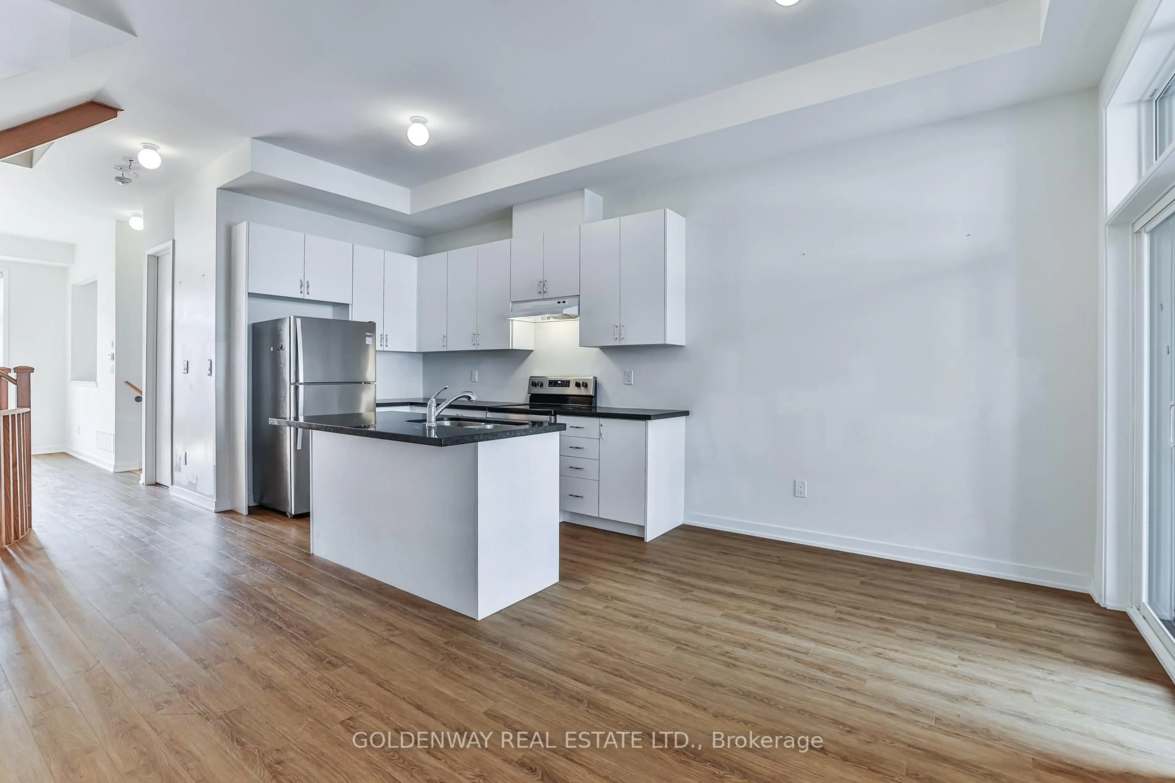 Open concept kitchen, wood/laminate floor for 31 Wuhan Lane, Markham Ontario L6E 0V4