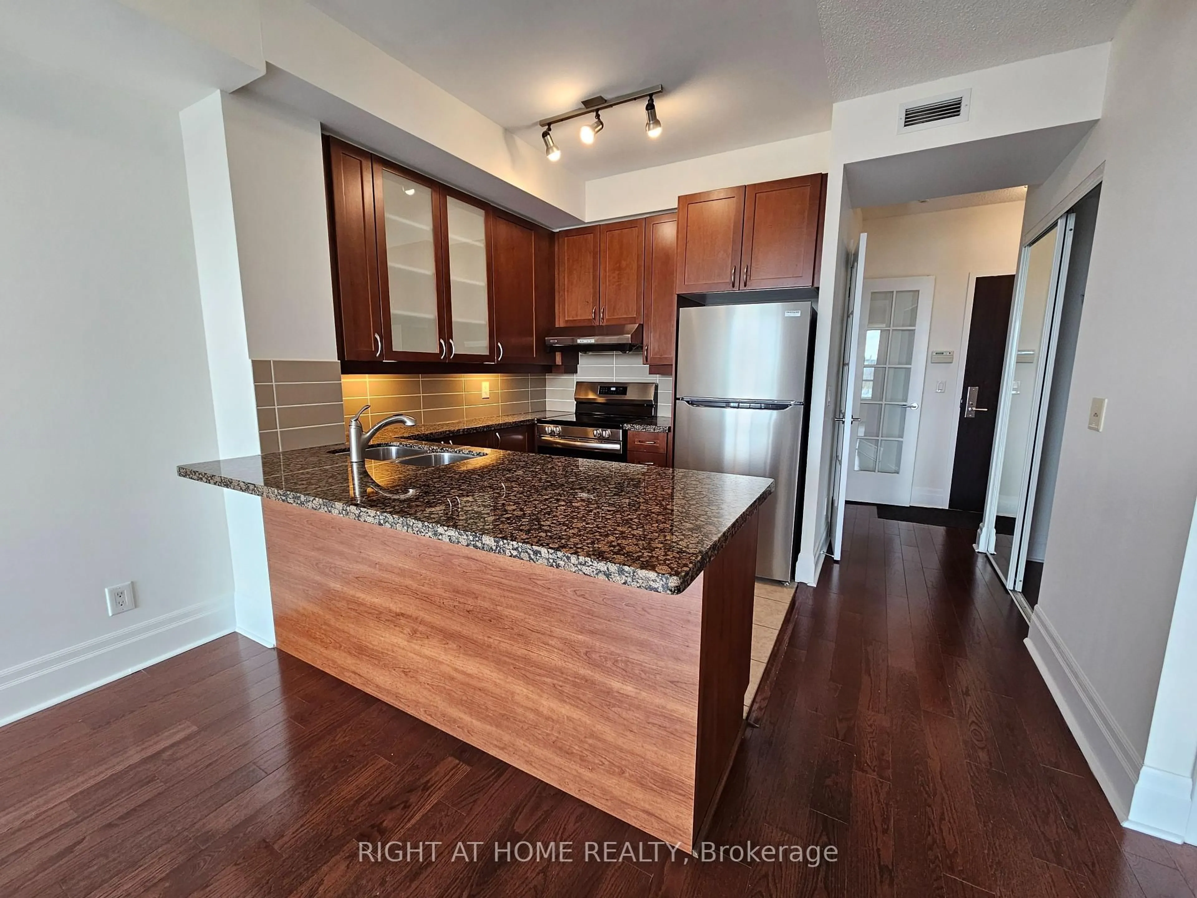 Open concept kitchen, wood/laminate floor for 39 Upper Duke Cres #306, Markham Ontario L6G 0B8