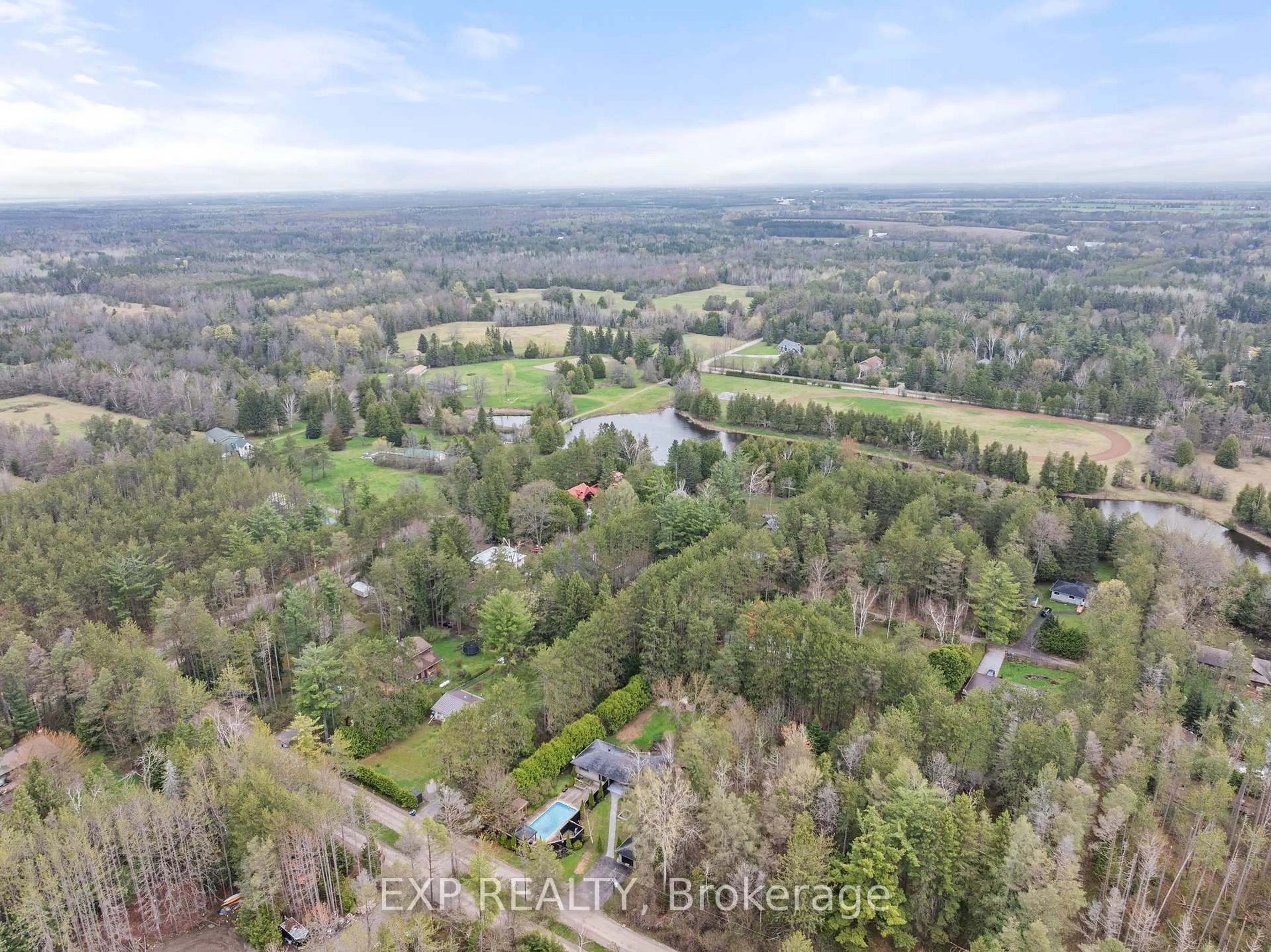A pic from outside/outdoor area/front of a property/back of a property/a pic from drone, forest/trees view for 37 Manniku Rd, Georgina Ontario L9P 1R2