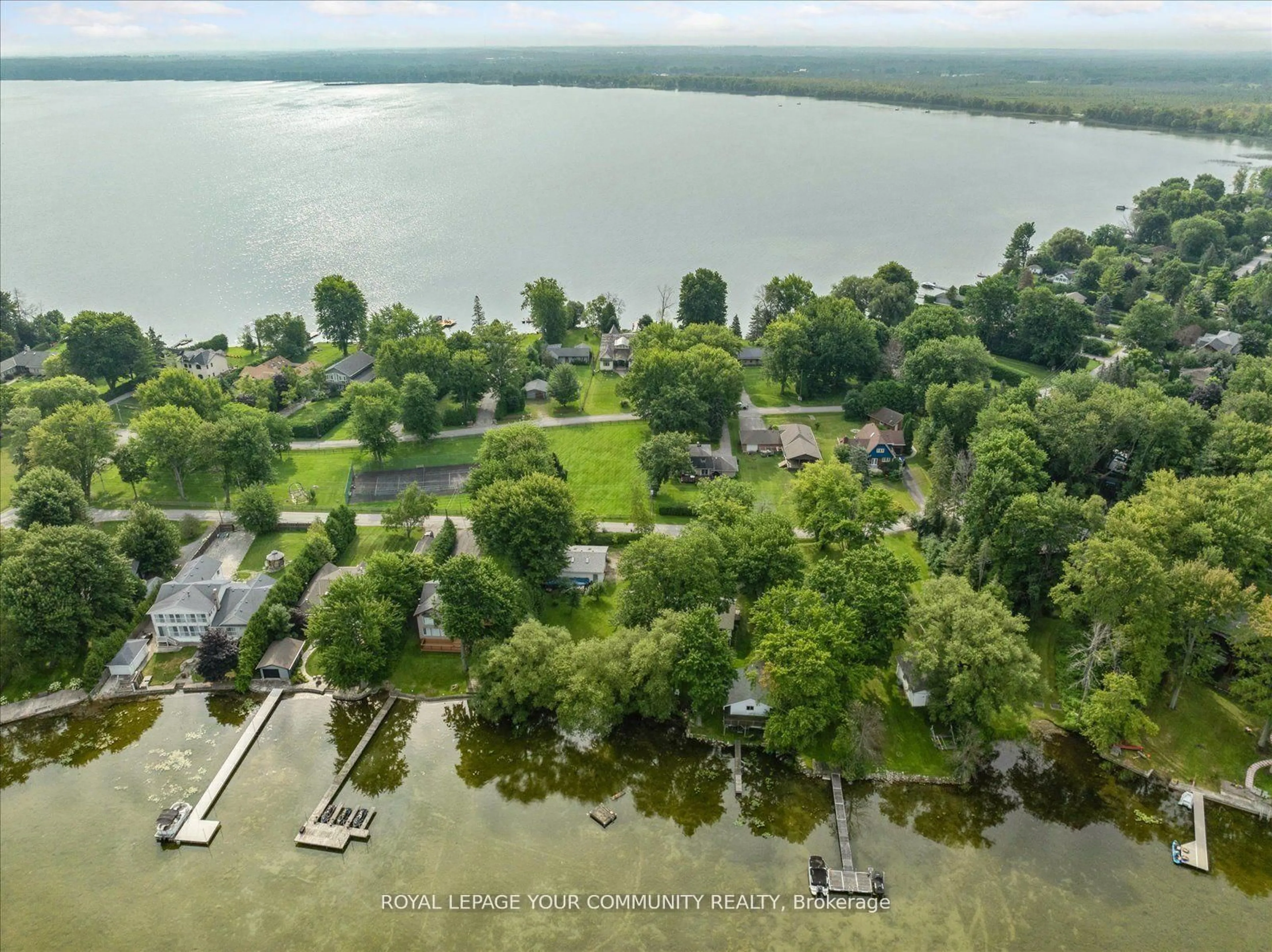 A pic from outside/outdoor area/front of a property/back of a property/a pic from drone, water/lake/river/ocean view for 580 Duclos Point Rd, Georgina Ontario L0E 1N0
