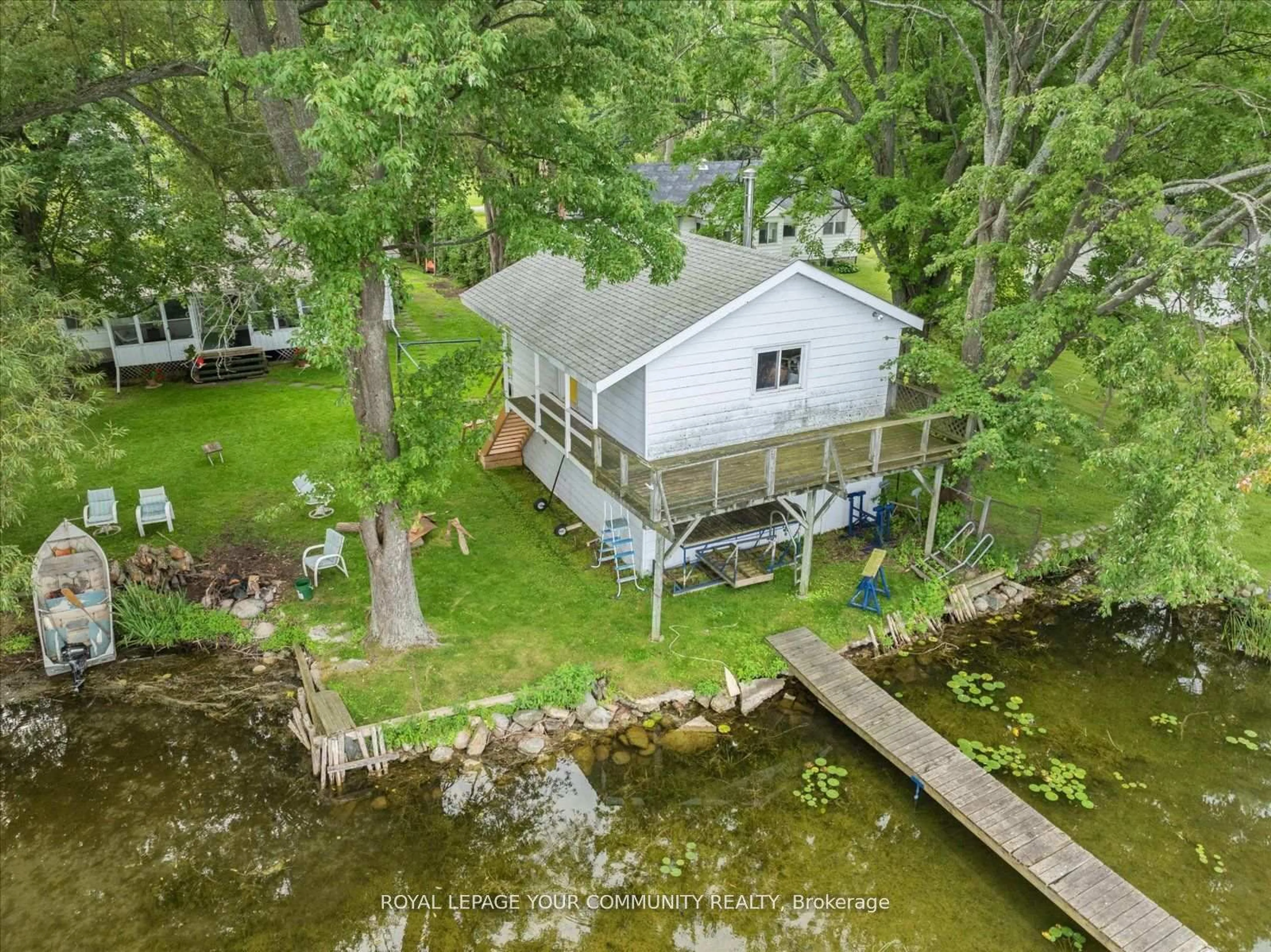 A pic from outside/outdoor area/front of a property/back of a property/a pic from drone, water/lake/river/ocean view for 580 Duclos Point Rd, Georgina Ontario L0E 1N0