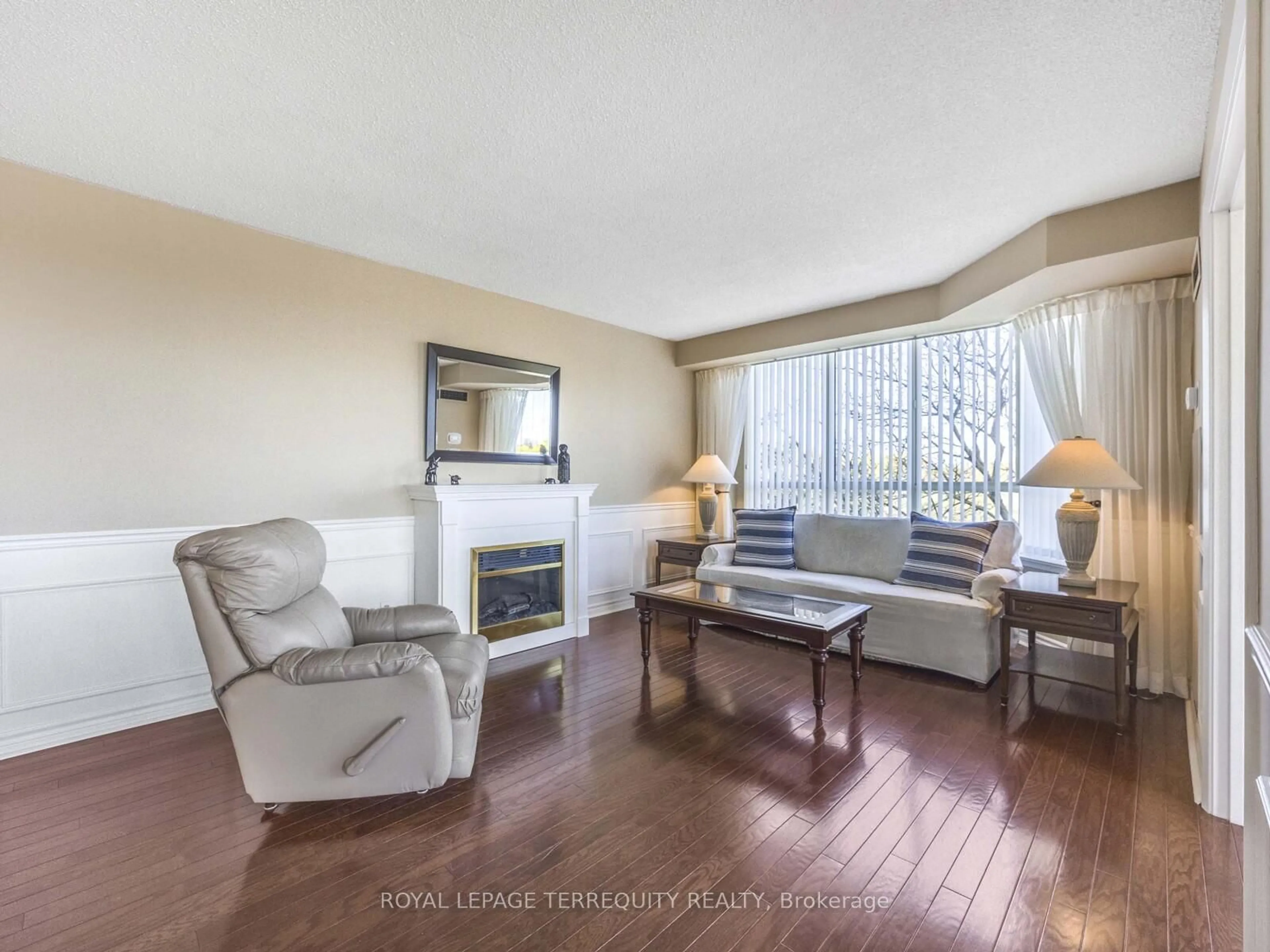 Living room with furniture, wood/laminate floor for 55 Austin Dr #312, Markham Ontario L3R 8H5
