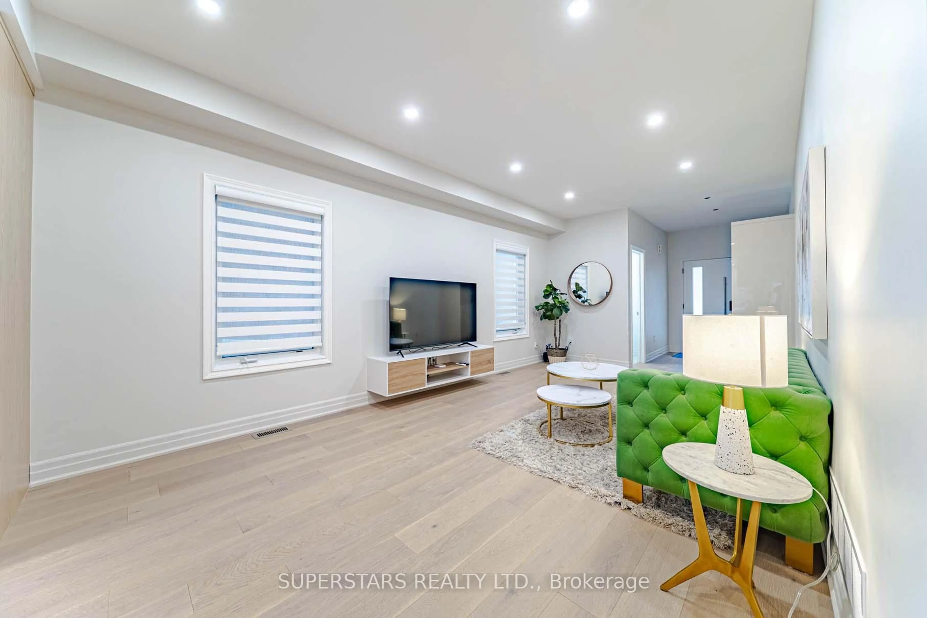 Living room with furniture, wood/laminate floor for 9 Neeley Rd, Markham Ontario L6E 0B2