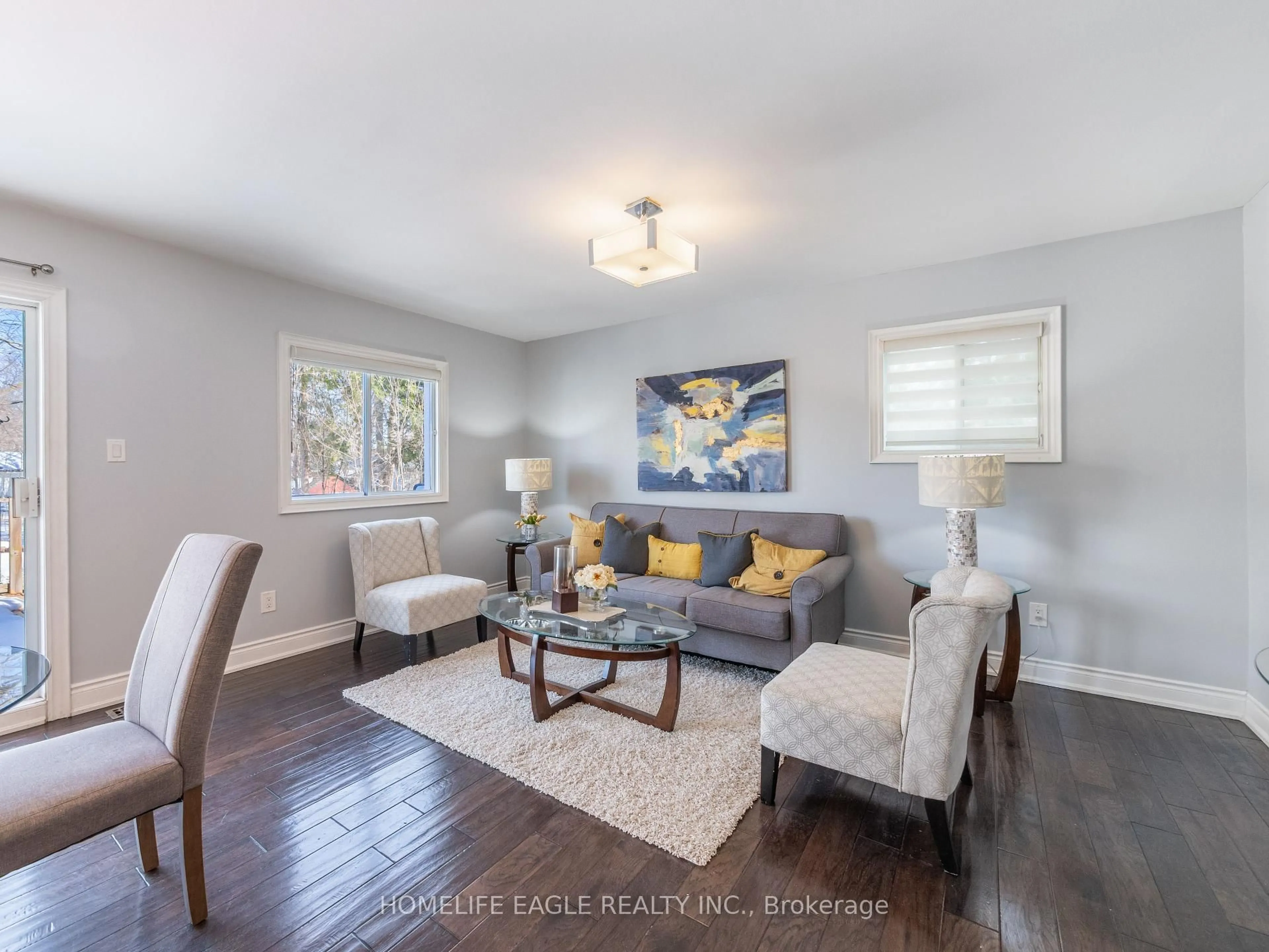 Living room with furniture, wood/laminate floor for 2049 Kate Ave, Innisfil Ontario L9S 1Y2
