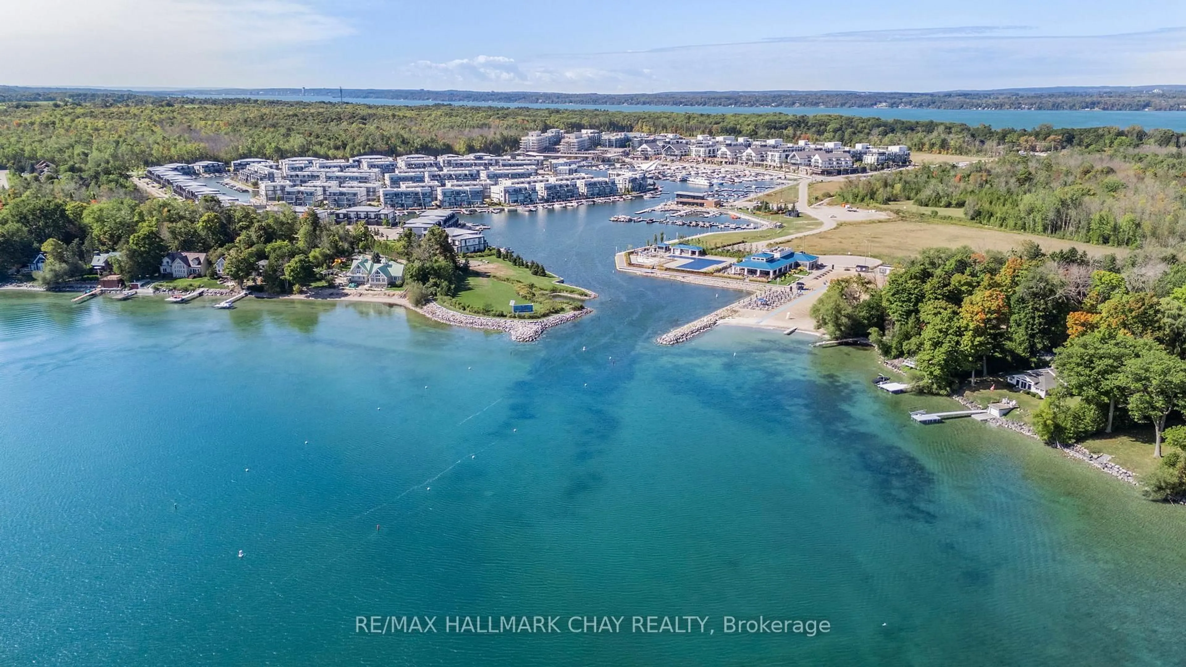 A pic from outside/outdoor area/front of a property/back of a property/a pic from drone, water/lake/river/ocean view for 333 Sea Ray Ave #207D, Innisfil Ontario L9S 0J4
