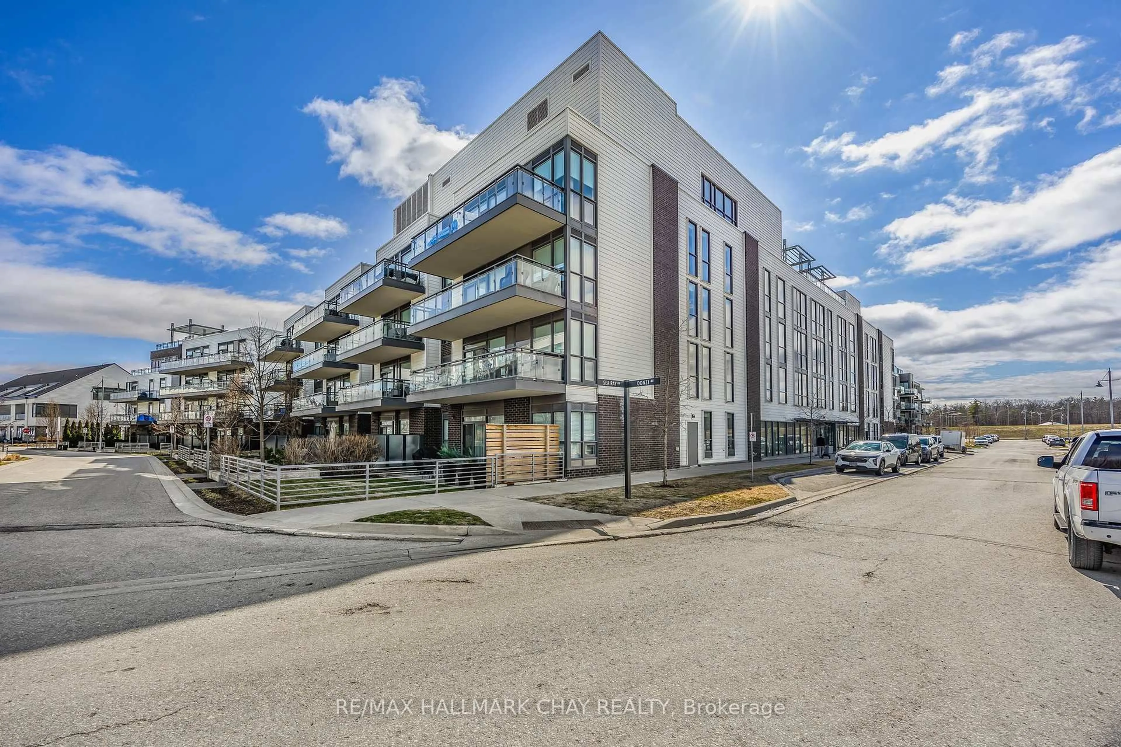 A pic from outside/outdoor area/front of a property/back of a property/a pic from drone, street for 333 Sea Ray Ave #207D, Innisfil Ontario L9S 0J4