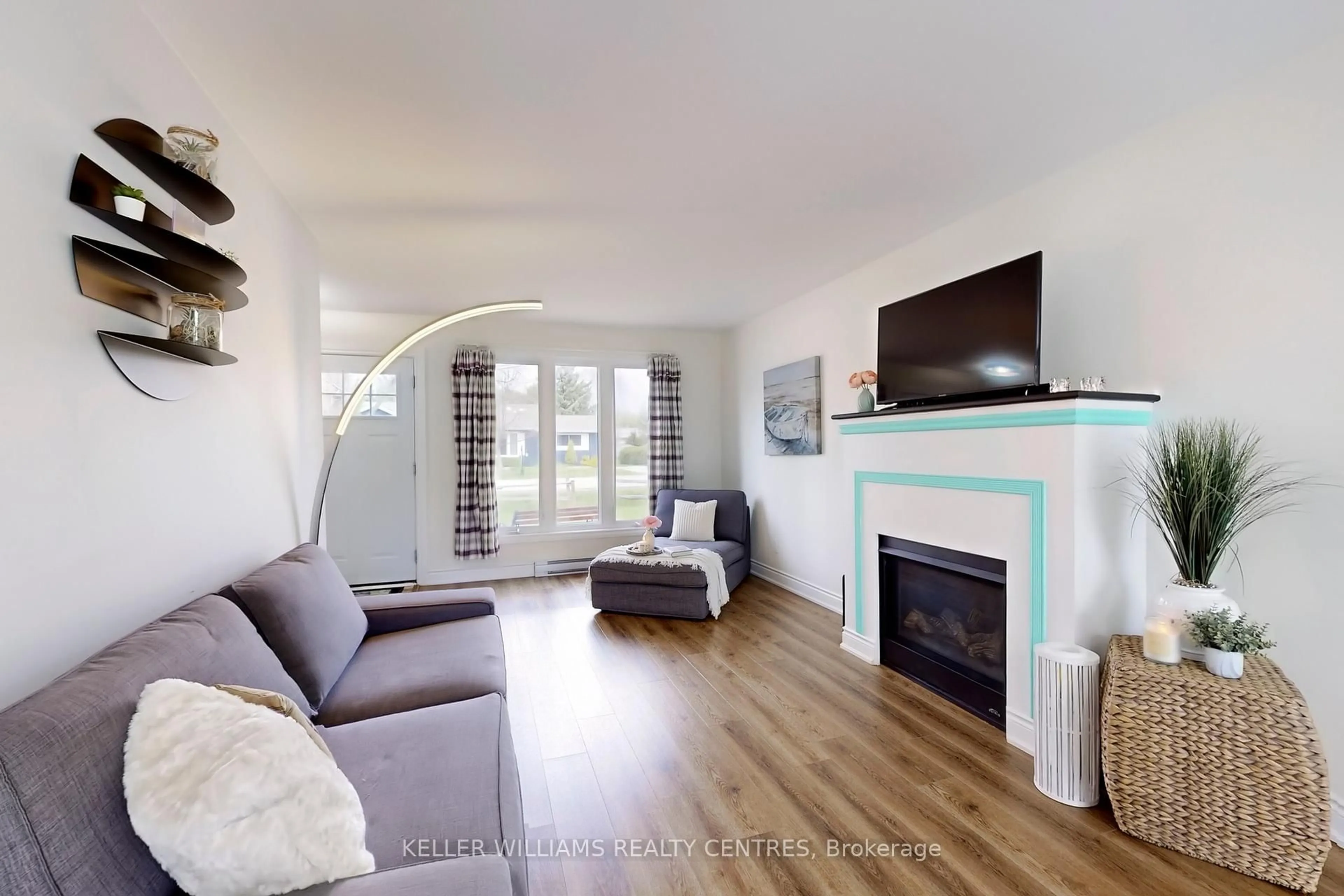 Living room with furniture, wood/laminate floor for 367 Adeline Dr, Georgina Ontario L4P 3C4