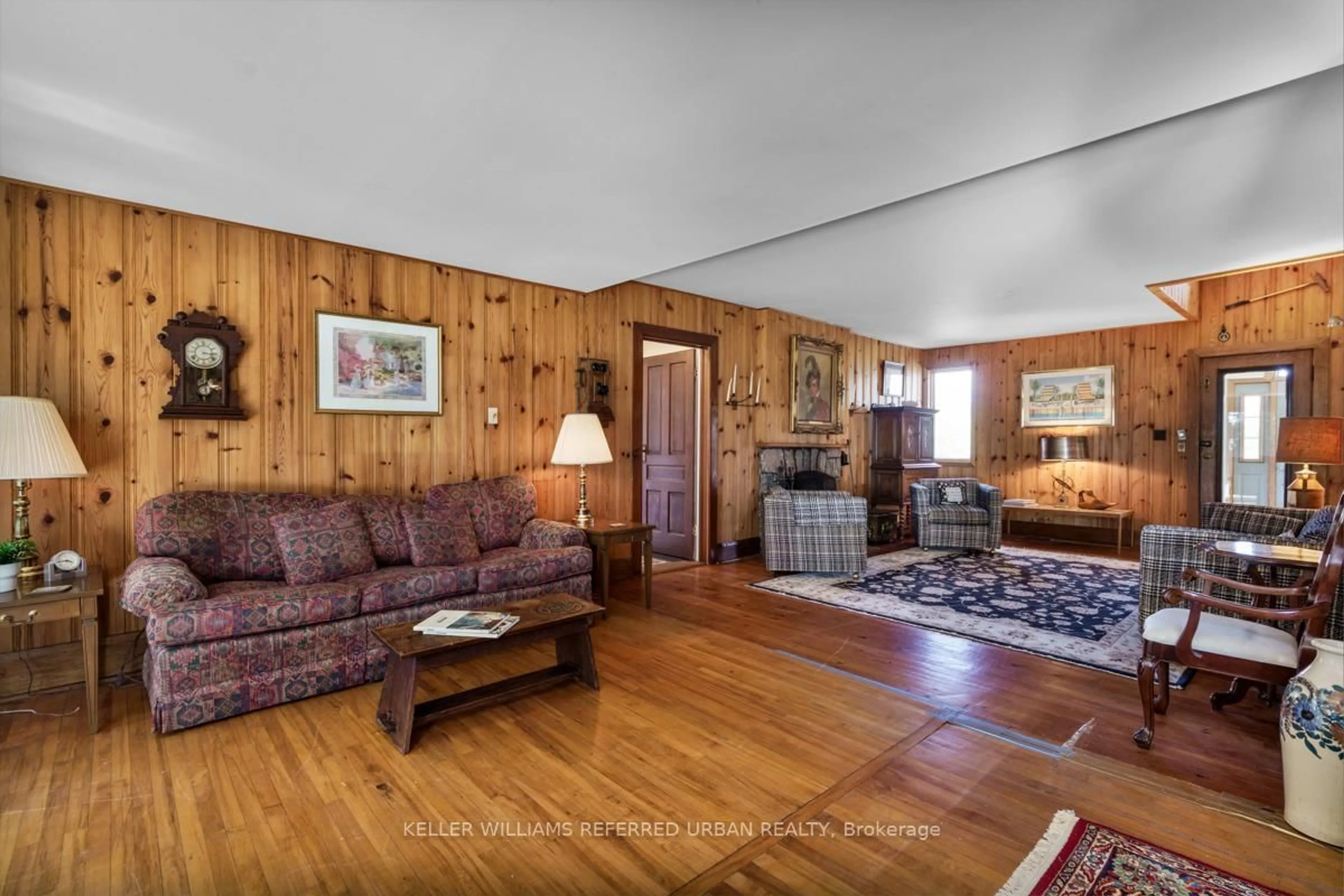 Living room with furniture, wood/laminate floor for 26950 Cedarhurst Beach Rd, Brock Ontario L0K 1A0
