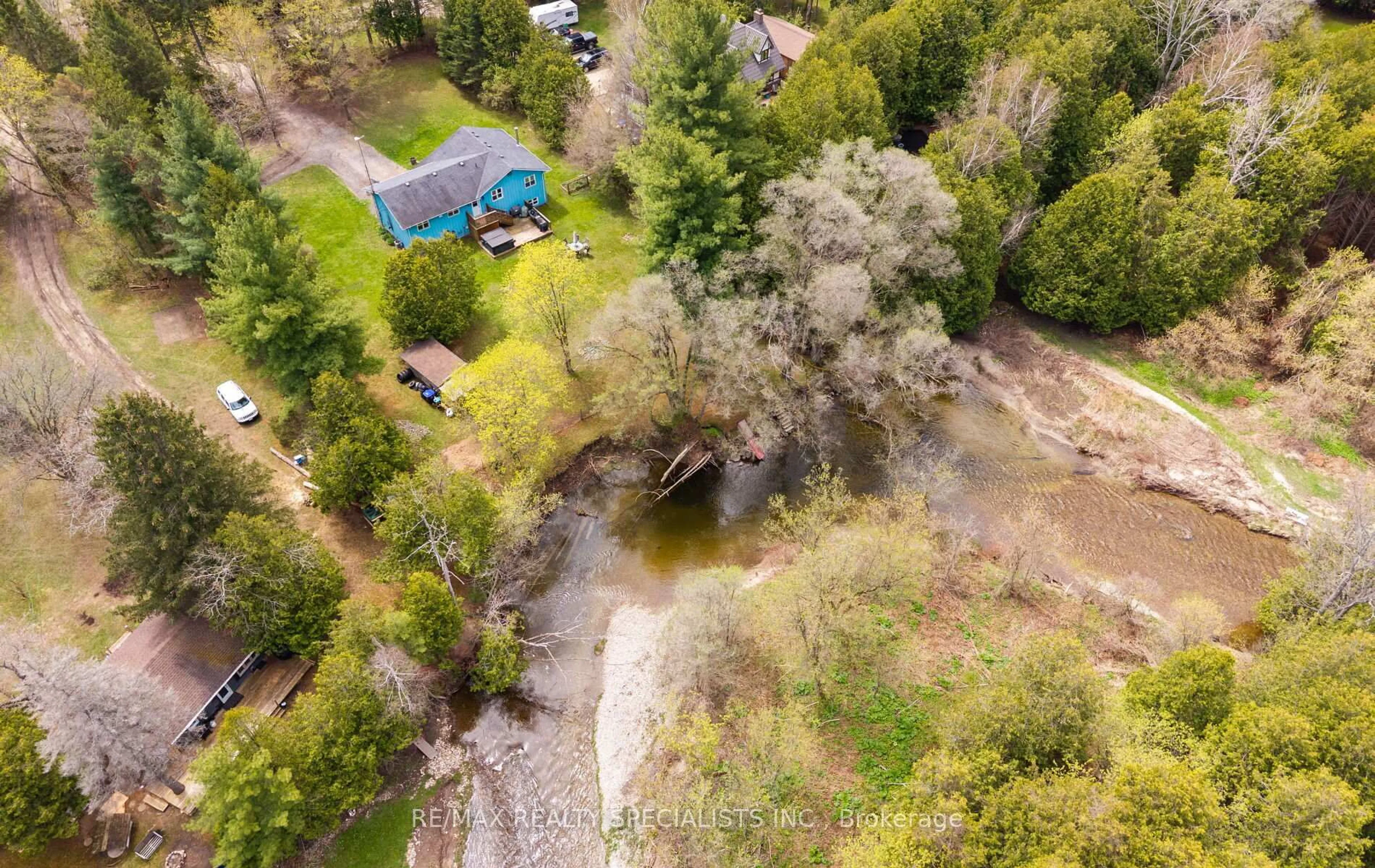 A pic from outside/outdoor area/front of a property/back of a property/a pic from drone, forest/trees view for 9048 River Rd, Adjala-Tosorontio Ontario L0N 1P0
