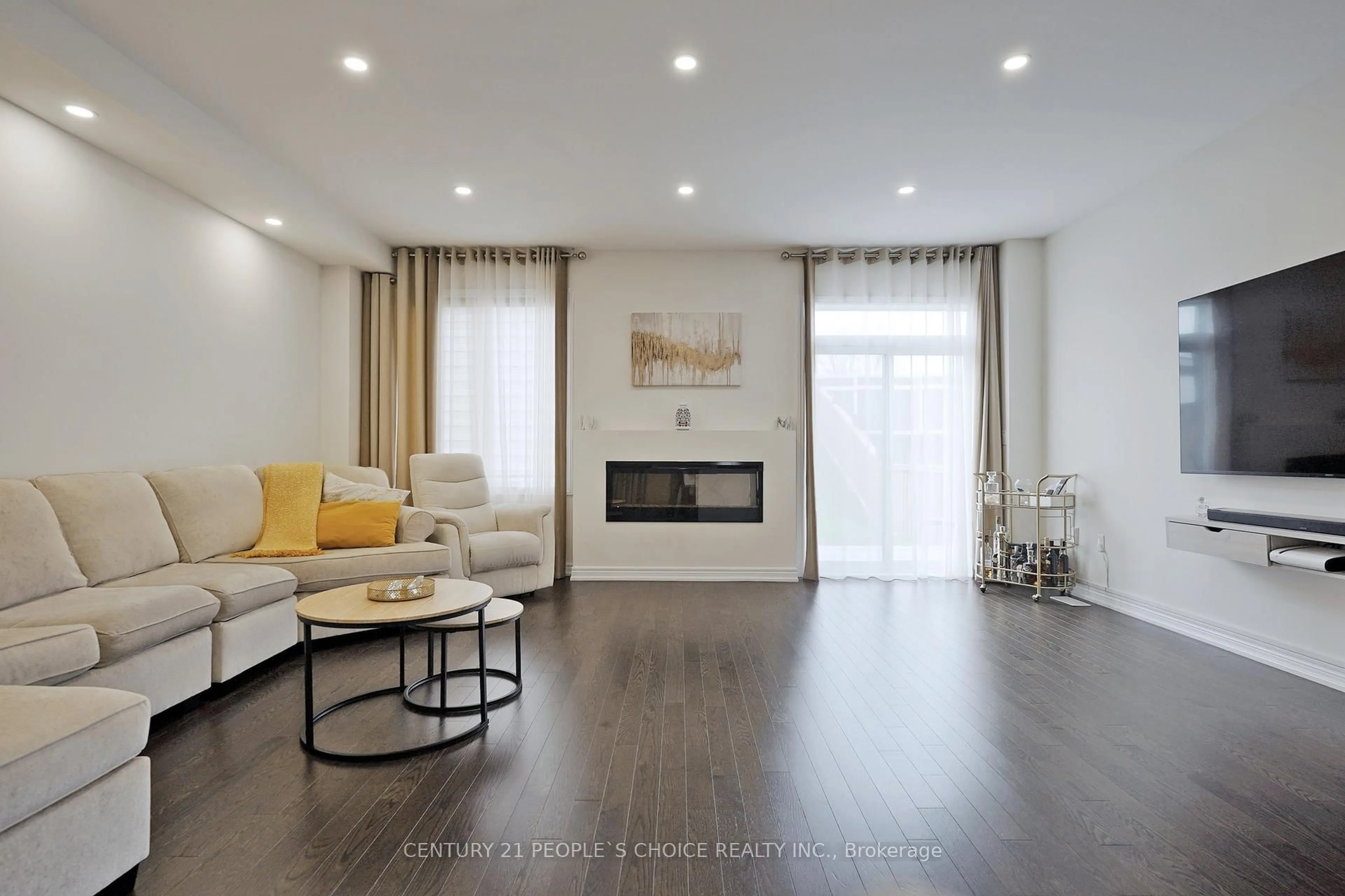 Living room with furniture, wood/laminate floor for 1976 Mcneil St, Innisfil Ontario L9S 0N7