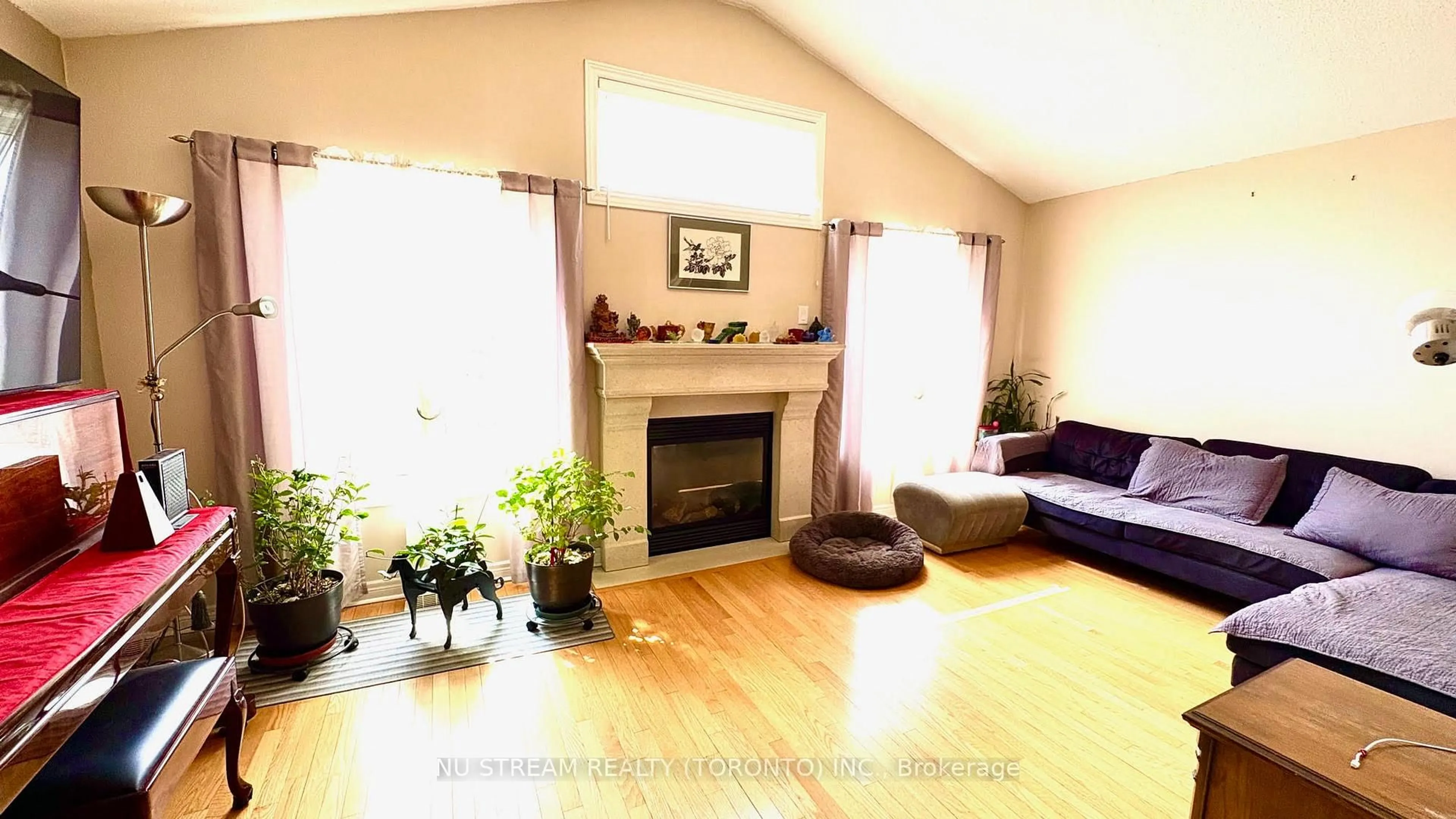 Living room with furniture, wood/laminate floor for 173 Downy Emerald Dr, Bradford West Gwillimbury Ontario L3Z 0E6