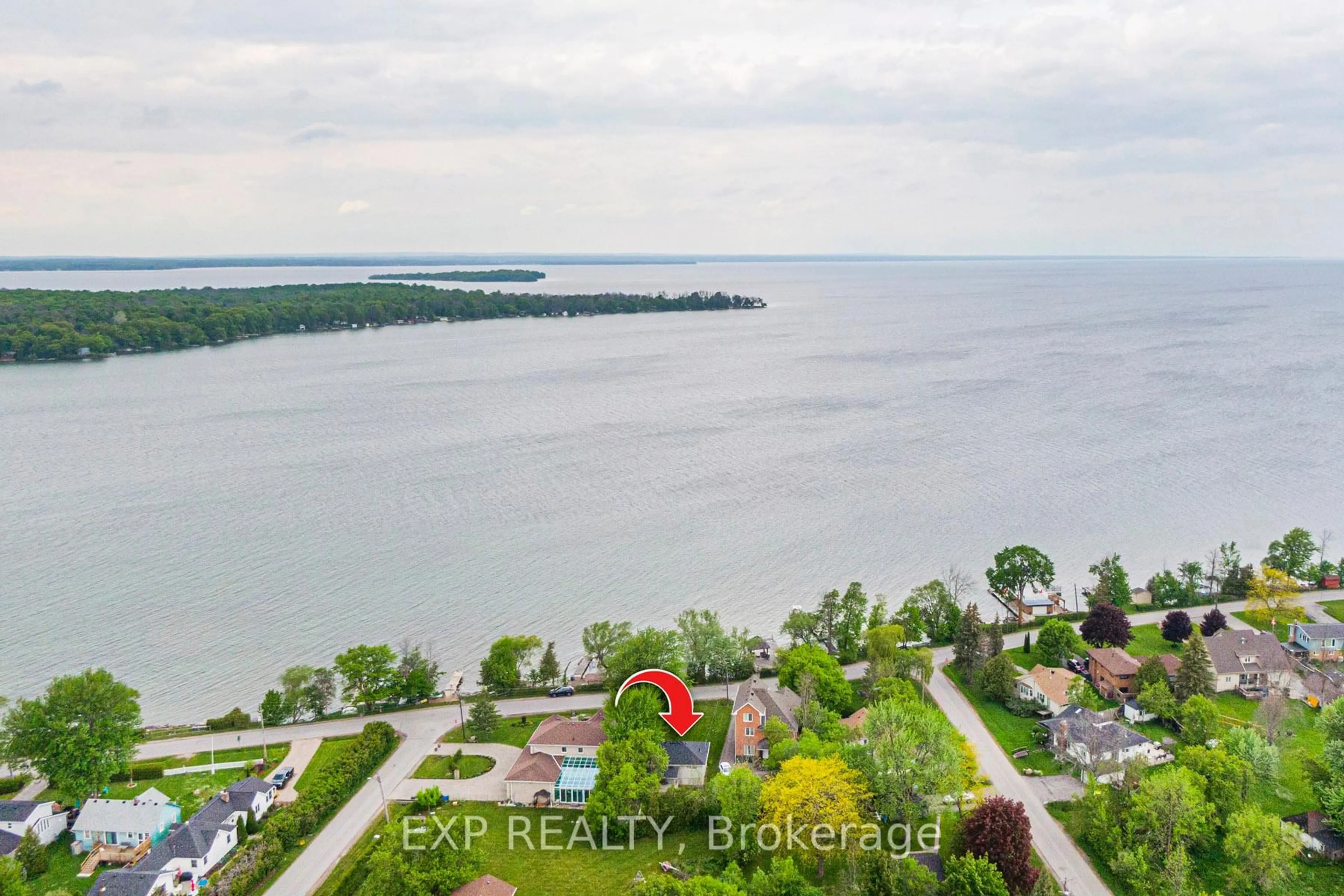 A pic from outside/outdoor area/front of a property/back of a property/a pic from drone, water/lake/river/ocean view for 17 Lake Dr, Georgina Ontario L4P 3E9