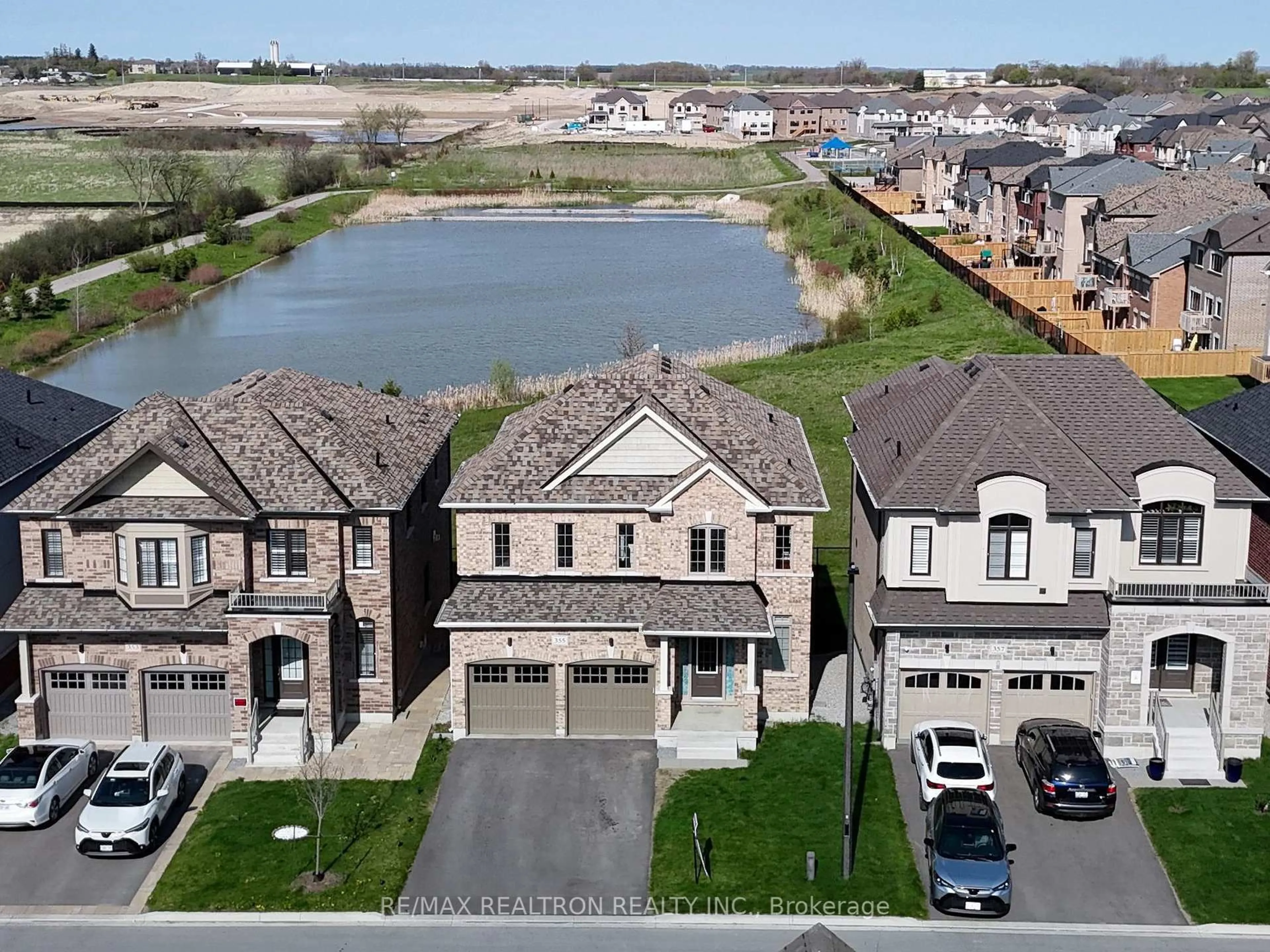 A pic from outside/outdoor area/front of a property/back of a property/a pic from drone, water/lake/river/ocean view for 355 Danny Wheeler Blvd, Georgina Ontario L4P 3C8