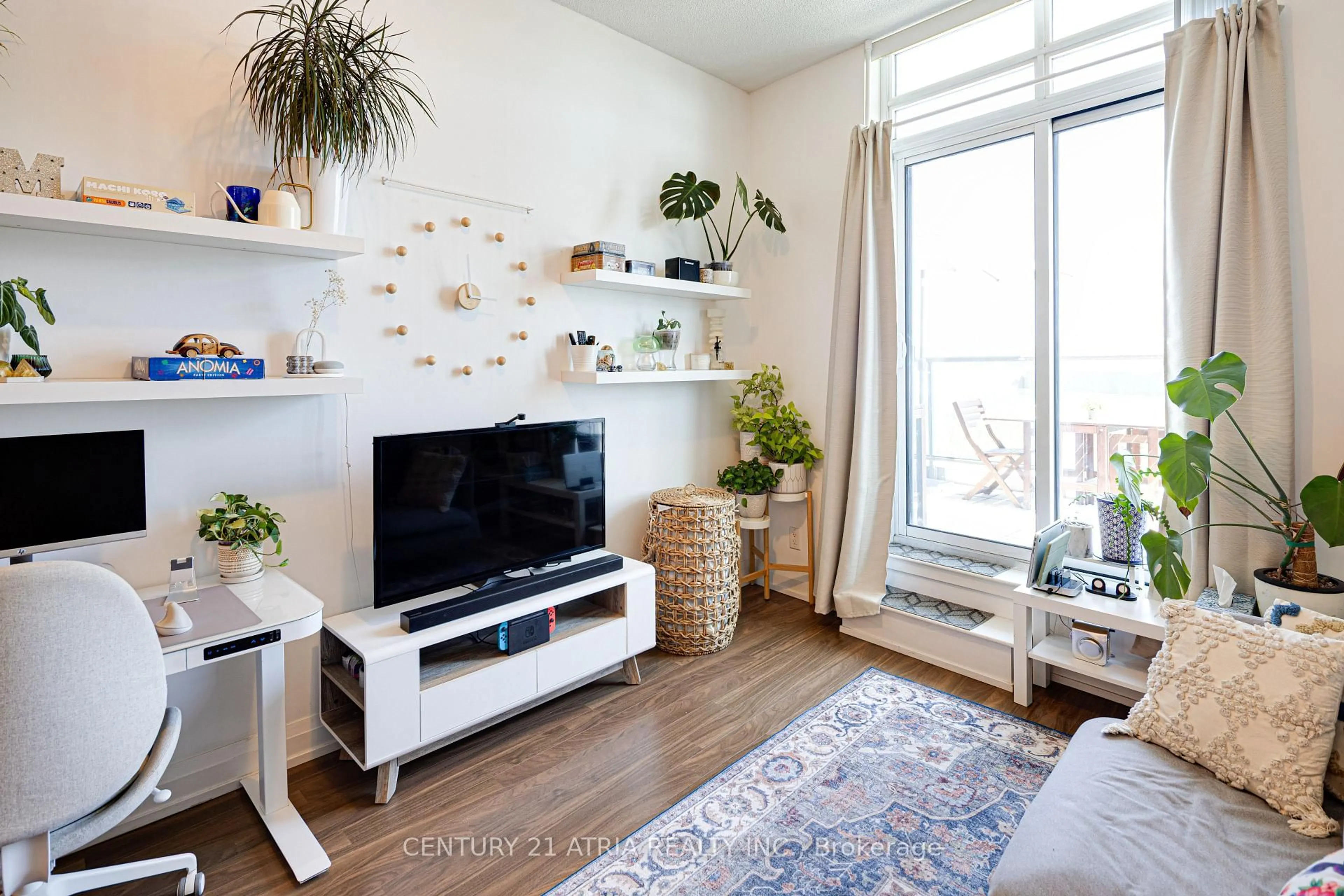 Living room with furniture, wood/laminate floor for 7161 Yonge St #328, Markham Ontario L3T 0C8