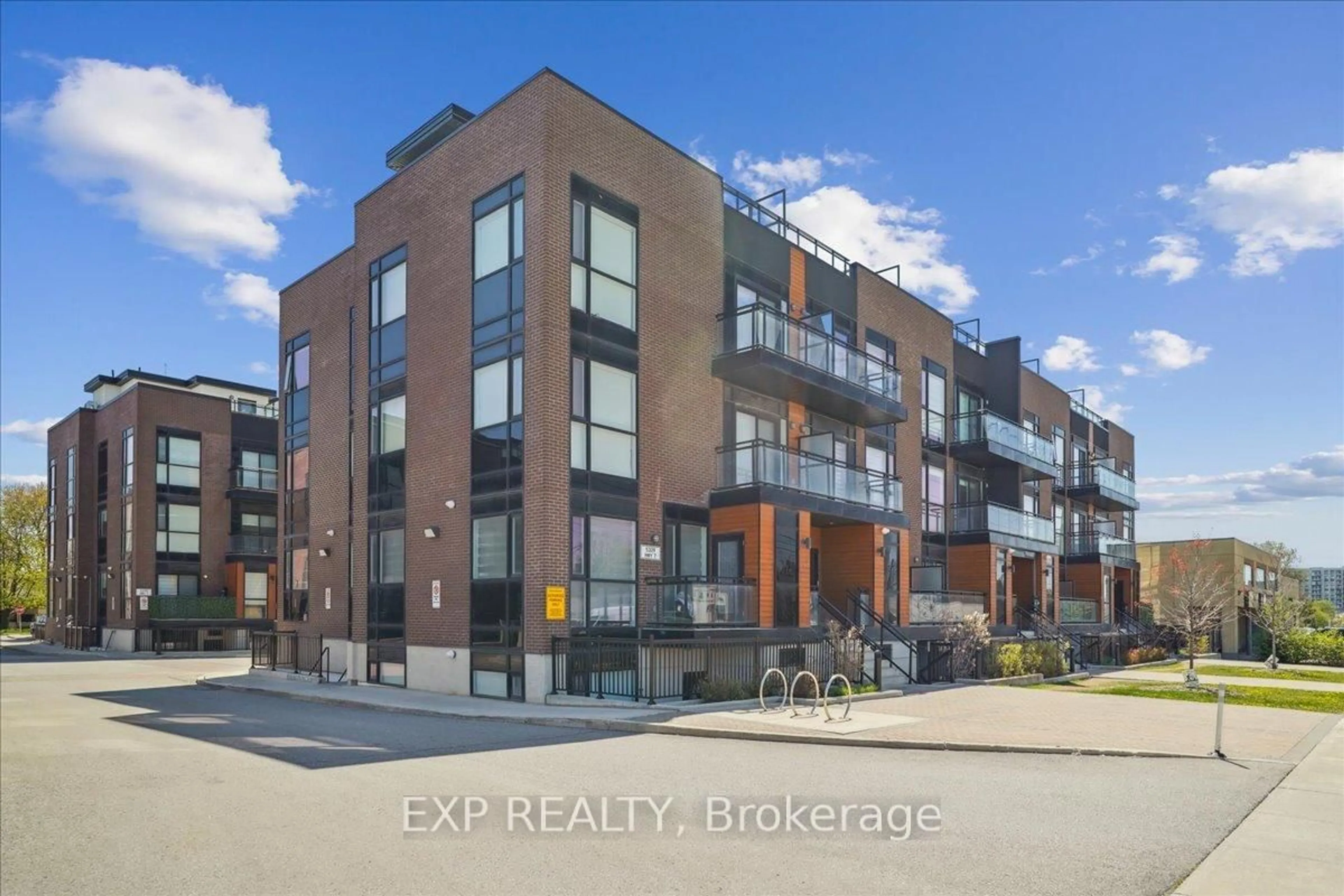 A pic from outside/outdoor area/front of a property/back of a property/a pic from drone, unknown for 5309 Highway 7 N/A #A203, Vaughan Ontario L4L 0J1