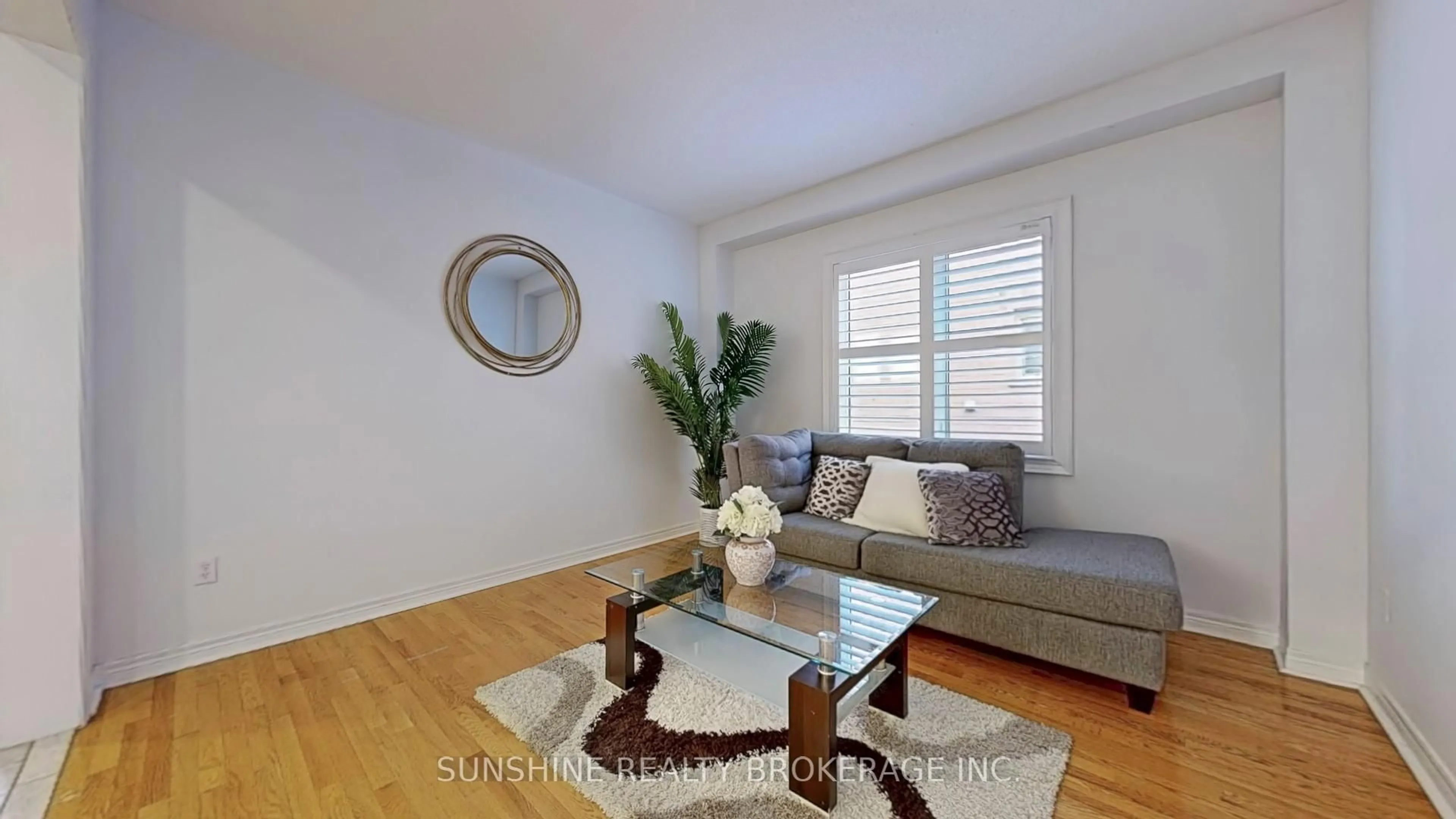 Living room with furniture, wood/laminate floor for 297 Castan Ave, Markham Ontario L3R 4S2