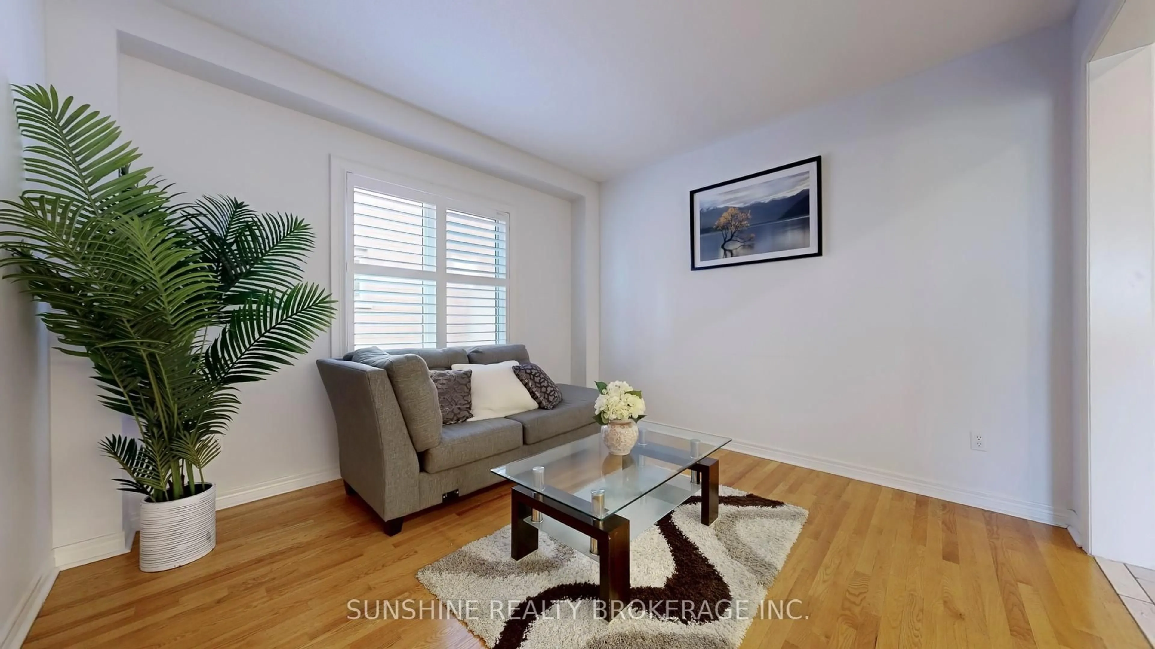 Living room with furniture, wood/laminate floor for 297 Castan Ave, Markham Ontario L3R 4S2