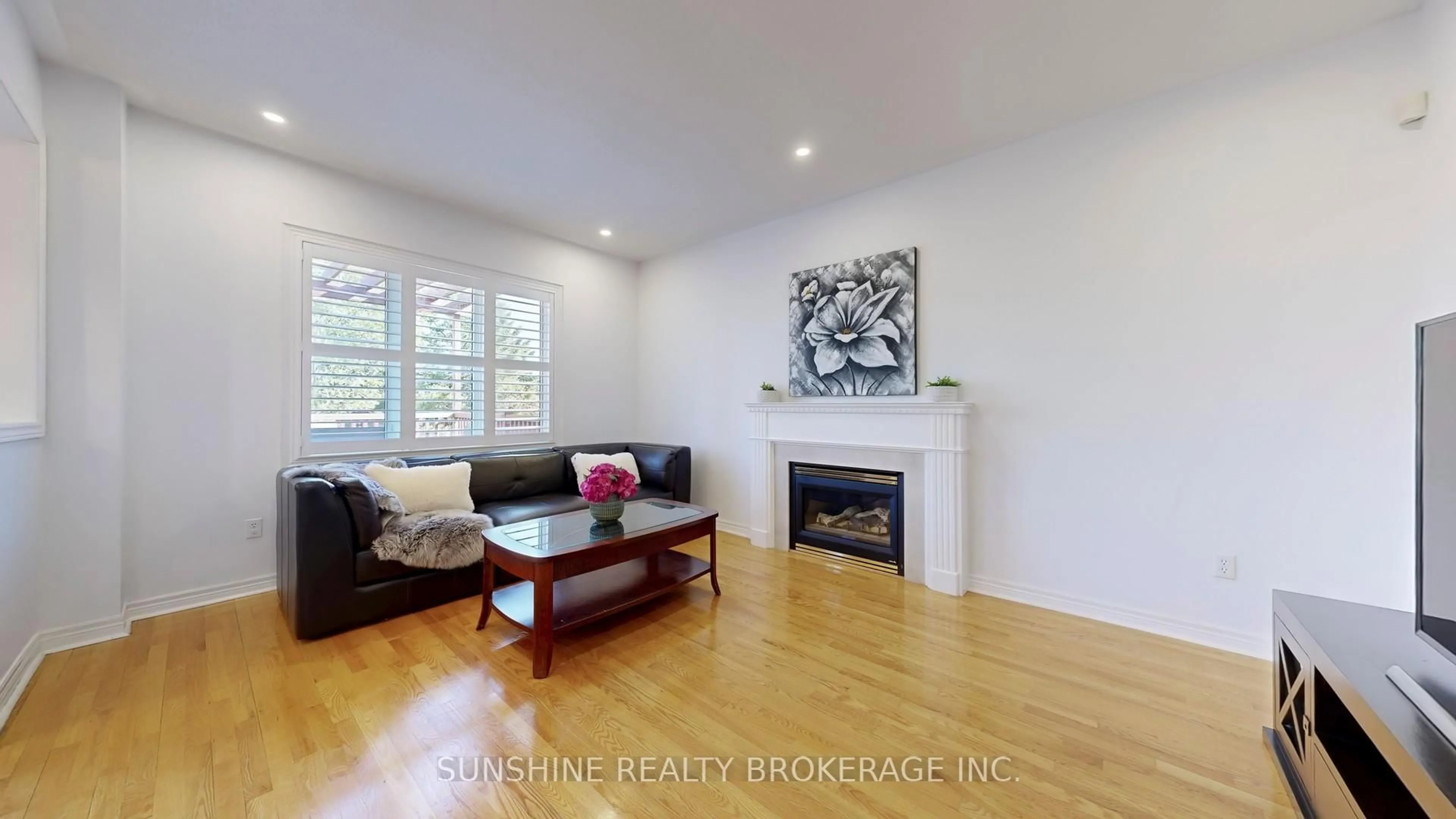 Living room with furniture, wood/laminate floor for 297 Castan Ave, Markham Ontario L3R 4S2
