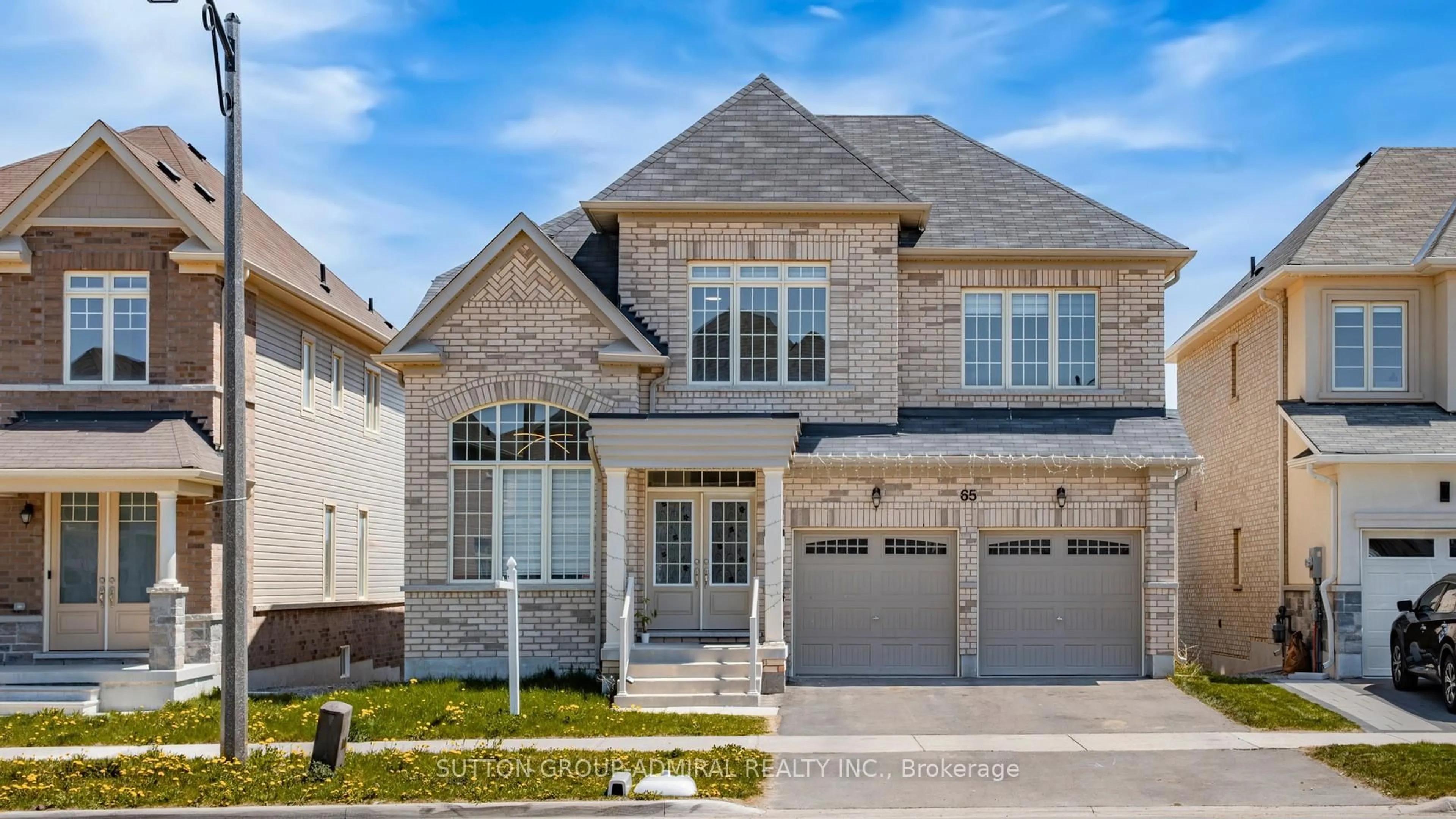 Home with brick exterior material, street for 65 Strathgreen Lane, Georgina Ontario L4P 0E9