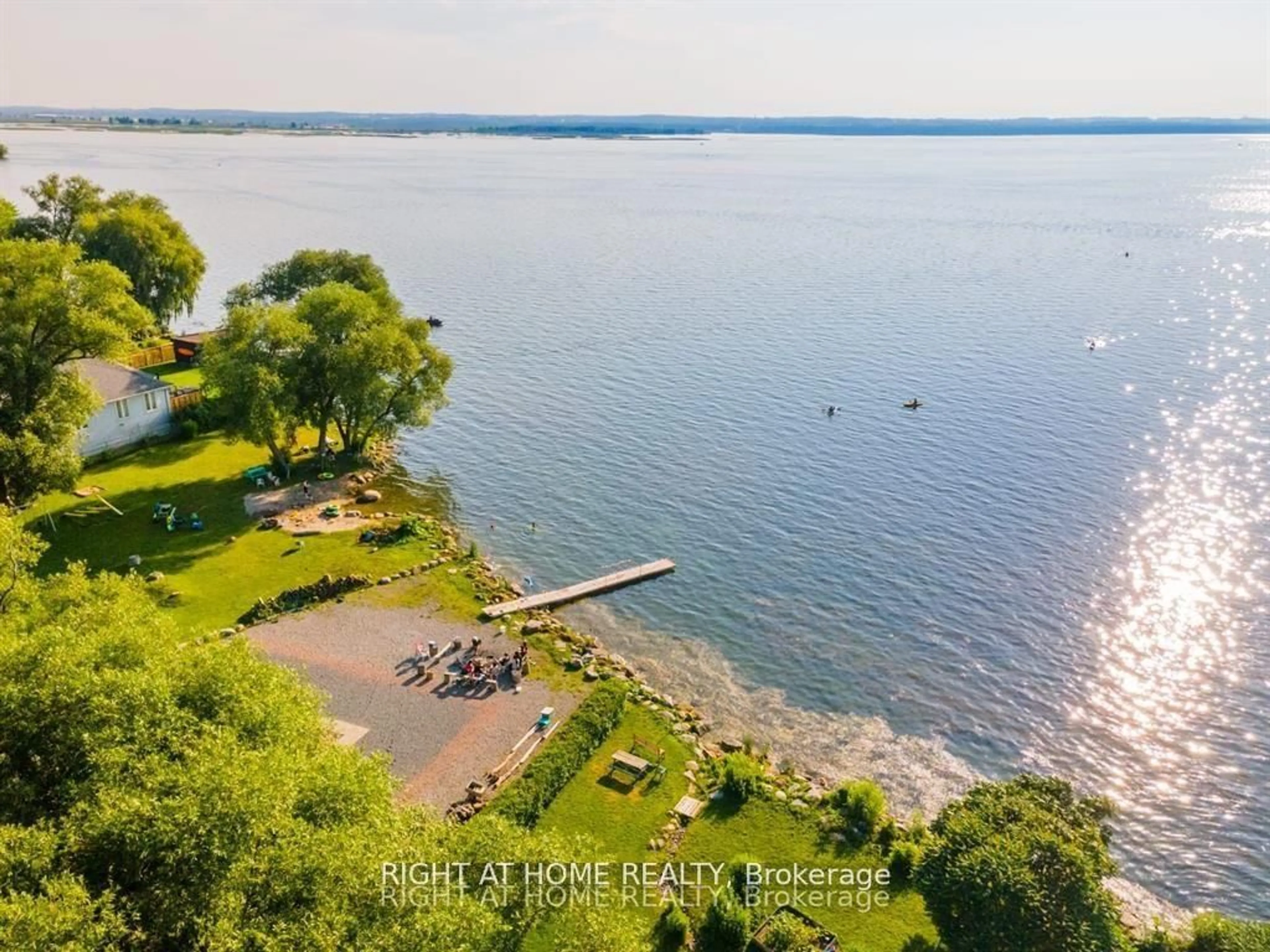 A pic from outside/outdoor area/front of a property/back of a property/a pic from drone, water/lake/river/ocean view for 208 Bayview Ave, Georgina Ontario L4P 2T2