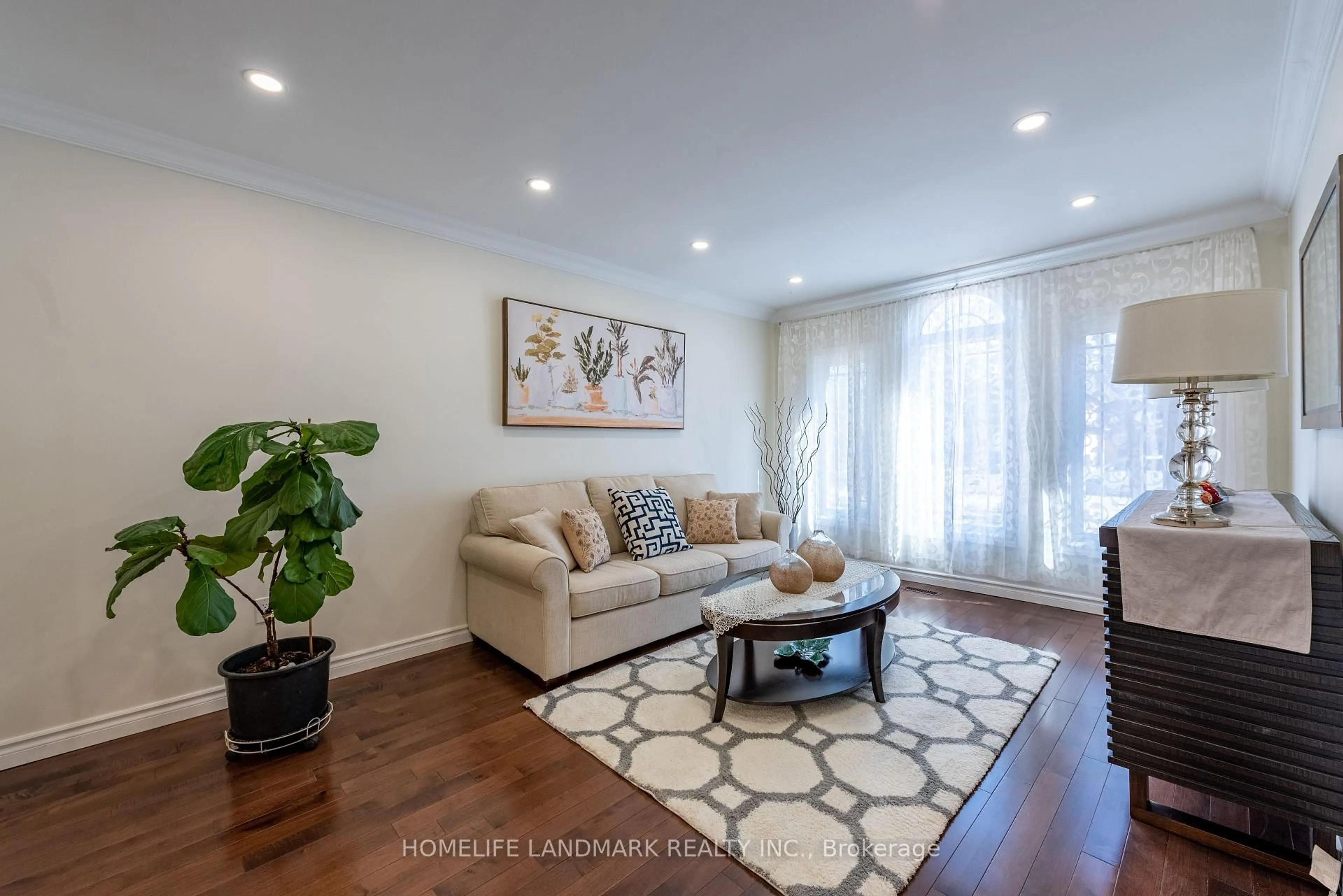 Living room with furniture, wood/laminate floor for 537 Raymerville Dr, Markham Ontario L3P 6G3