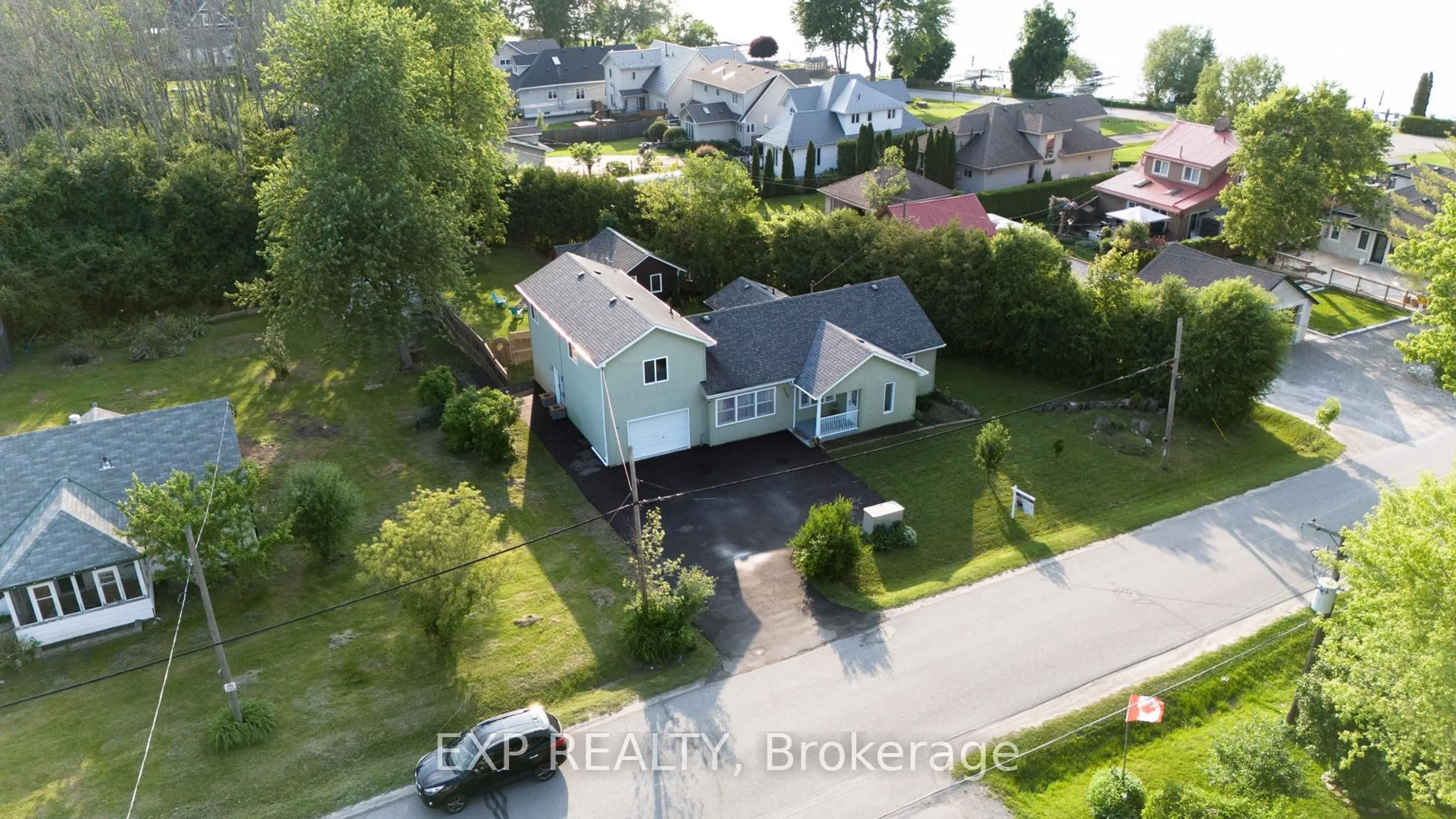 A pic from outside/outdoor area/front of a property/back of a property/a pic from drone, water/lake/river/ocean view for 27182 Civic Centre Rd, Georgina Ontario L0E 1S0