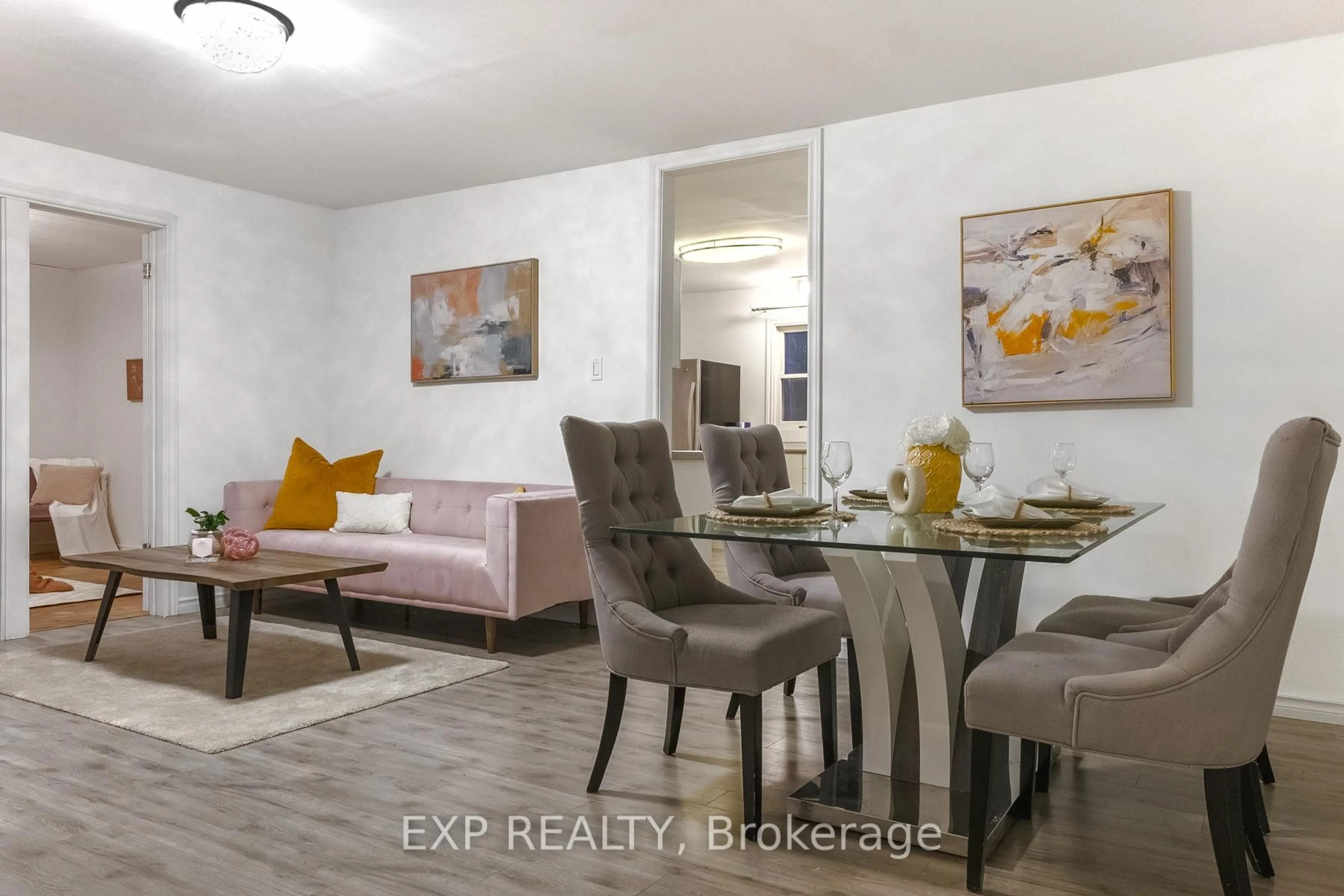 Living room with furniture, wood/laminate floor for 27182 Civic Centre Rd, Georgina Ontario L0E 1S0