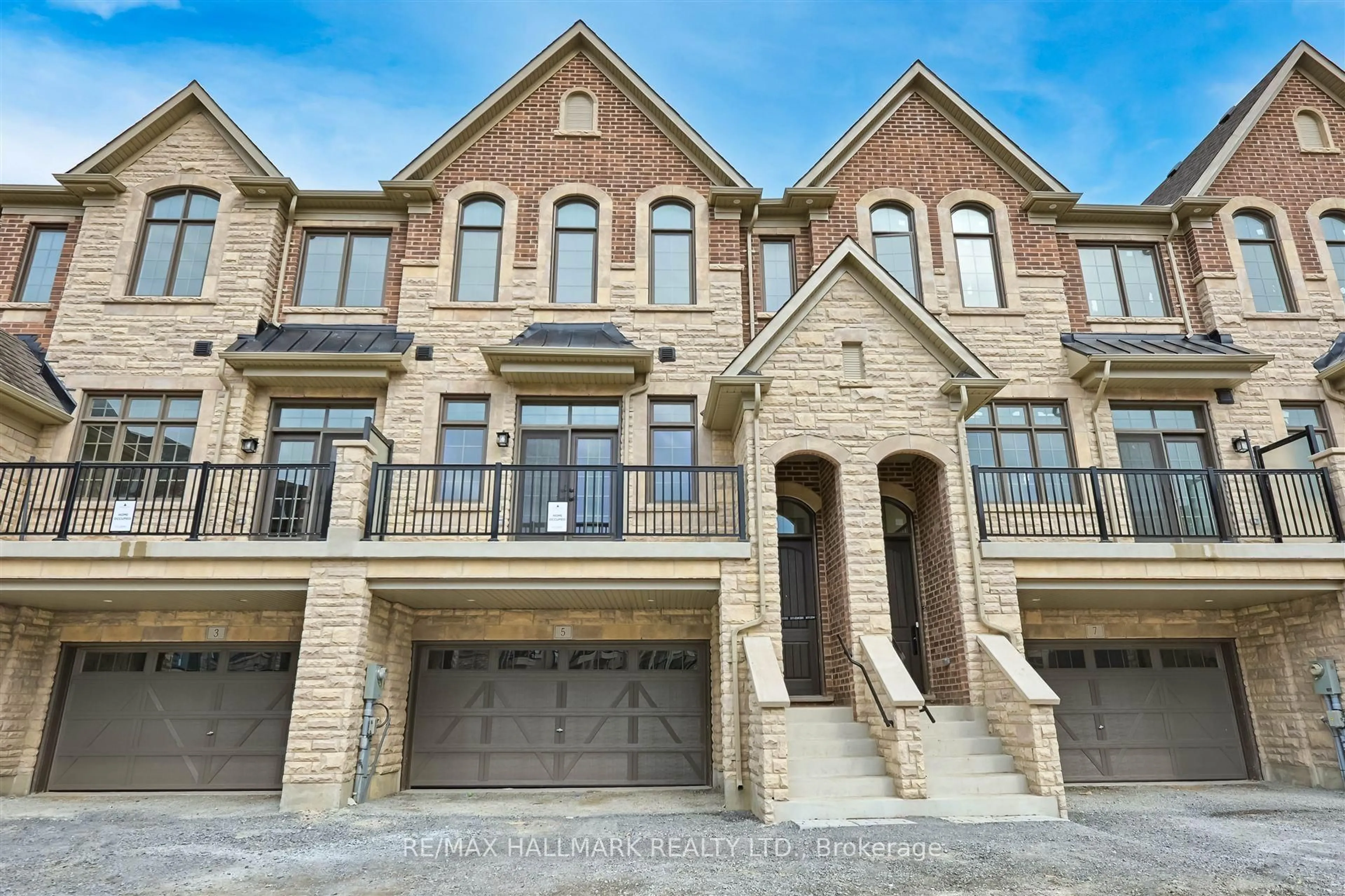 Home with brick exterior material, street for 5 West Village Lane, Markham Ontario L6C 3L5