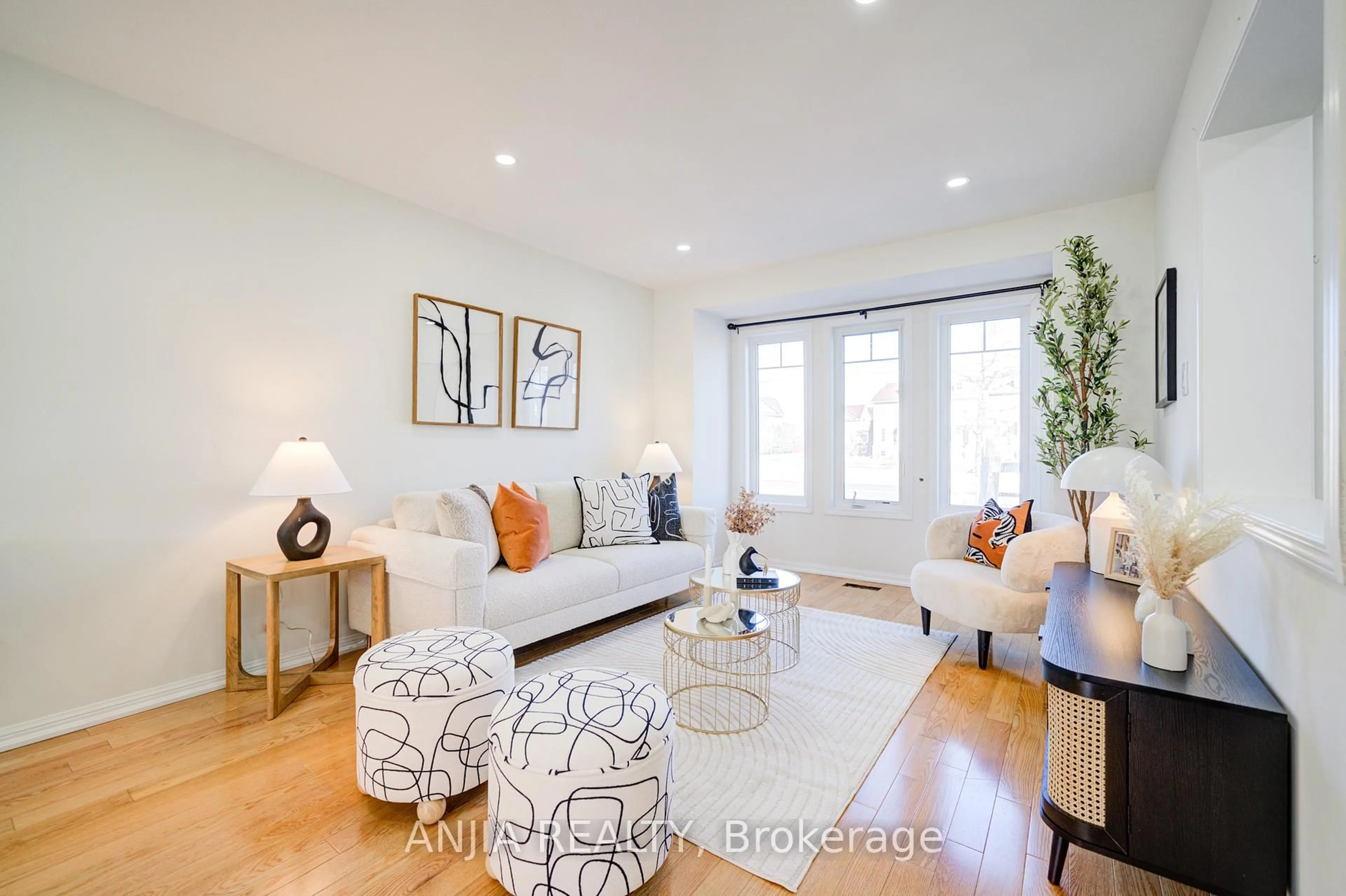 Living room with furniture, wood/laminate floor for 42 Gas Lamp Lane, Markham Ontario L6B 0H5