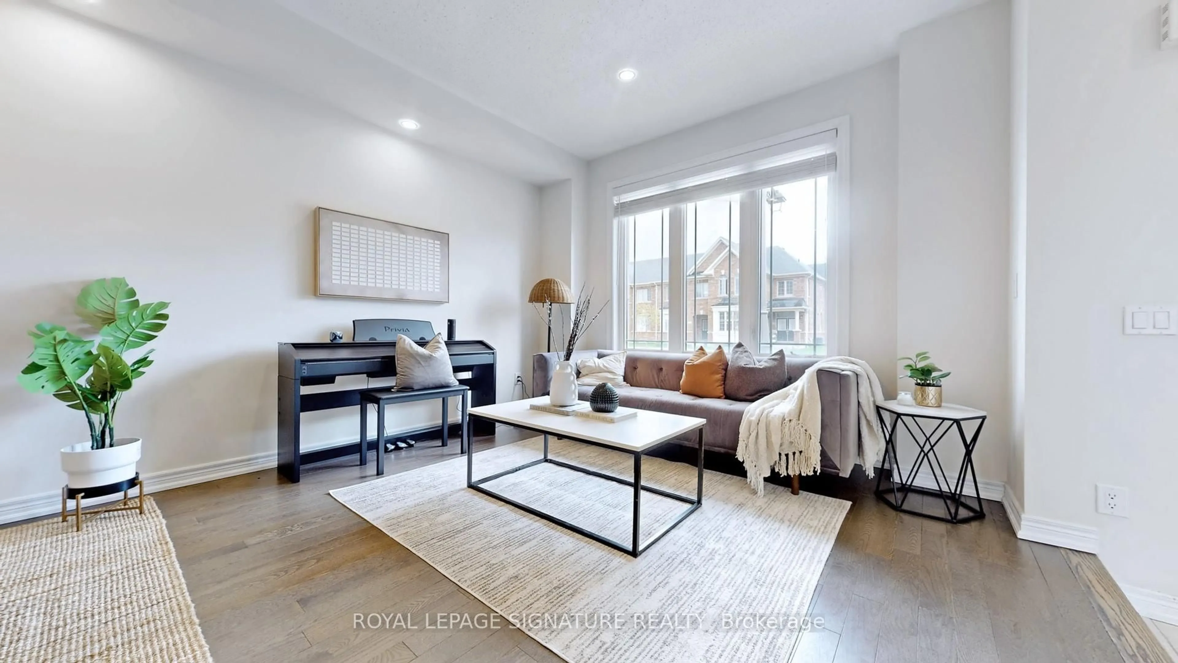 Living room with furniture, wood/laminate floor for 178 Northvale Rd, Markham Ontario L6B 1J3