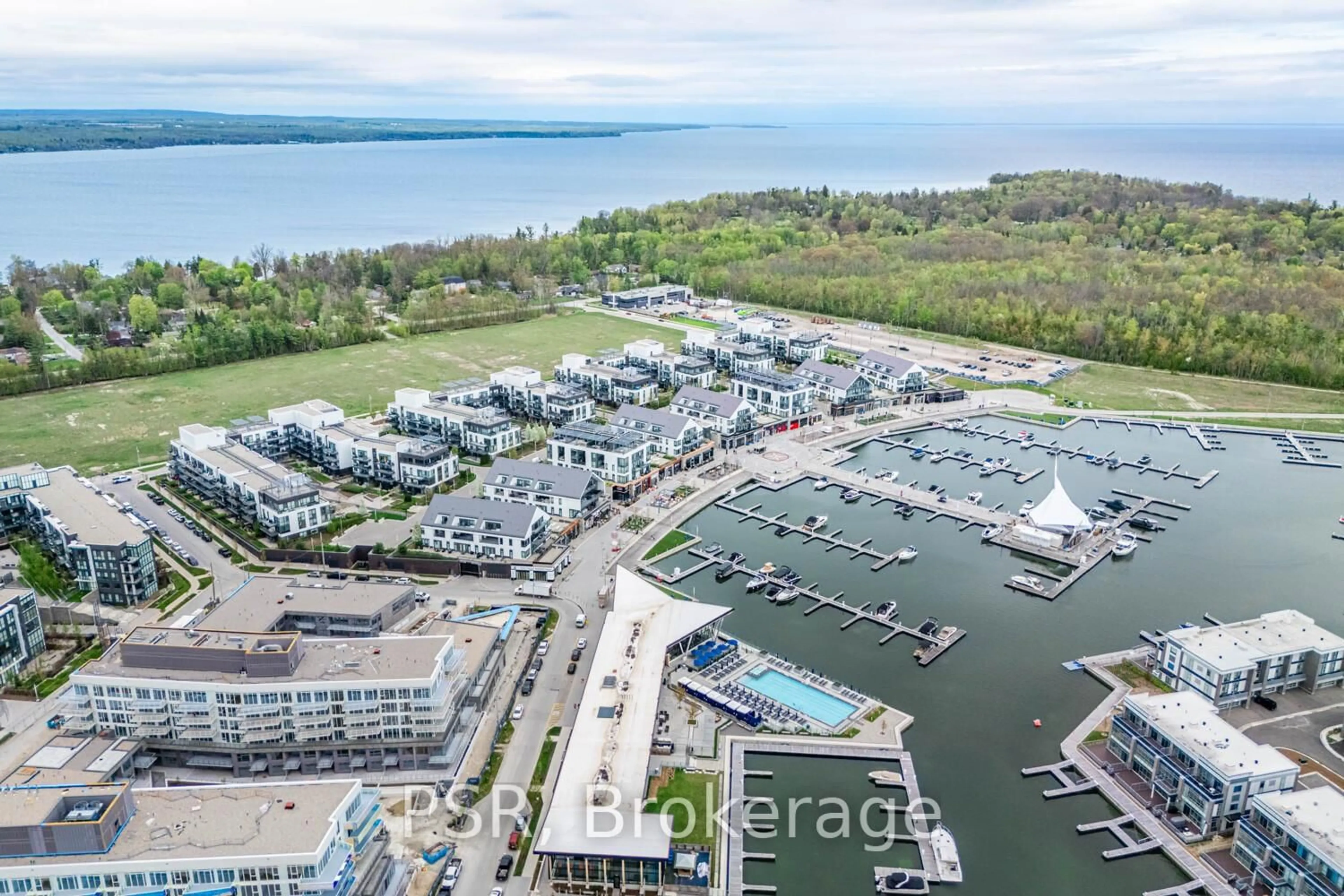 A pic from outside/outdoor area/front of a property/back of a property/a pic from drone, water/lake/river/ocean view for 415 Sea Ray Ave #233, Innisfil Ontario L9S 0N9