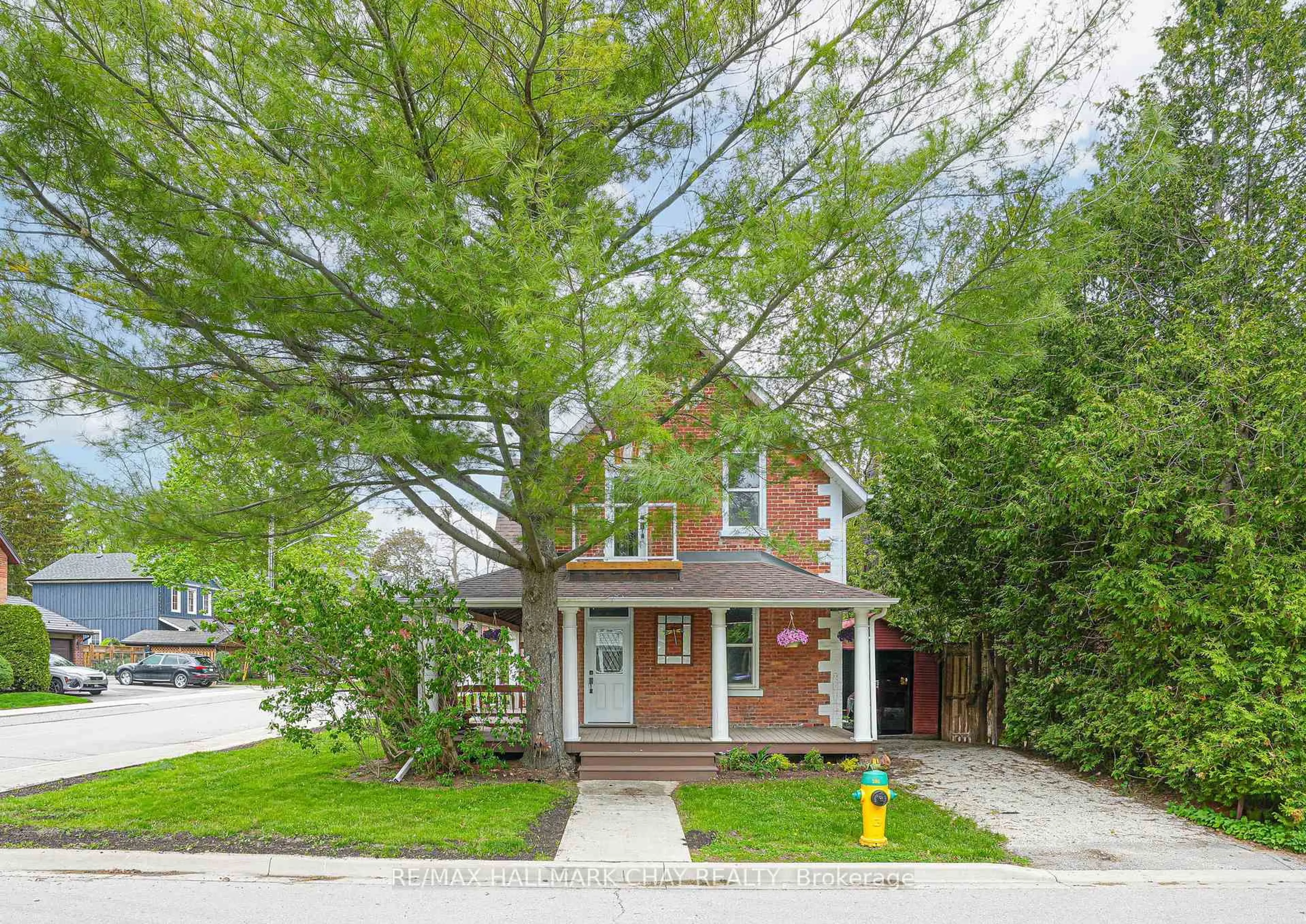 Home with brick exterior material, street for 14 Wilson St, New Tecumseth Ontario L0G 1W0