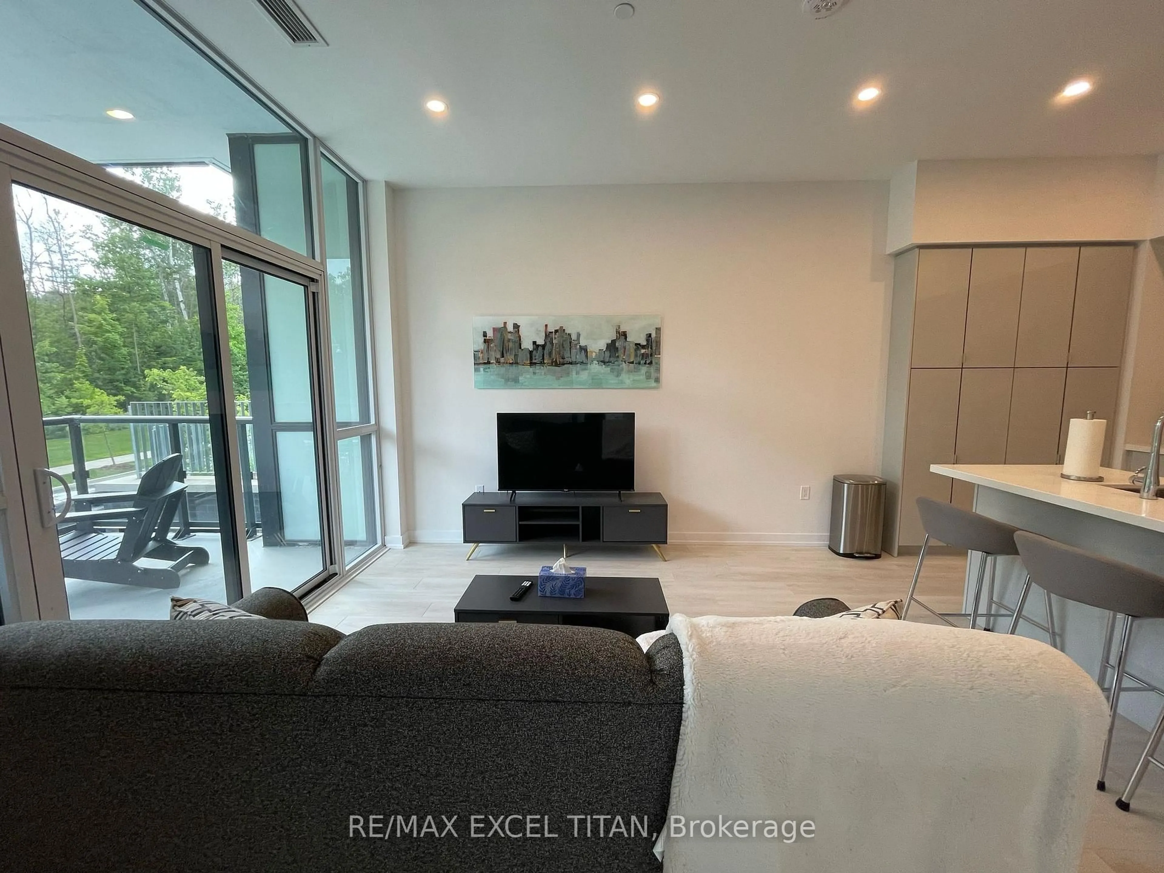 Living room with furniture, ceramic/tile floor for 415 Sea Ray Ave #140, Innisfil Ontario L9S 0R5