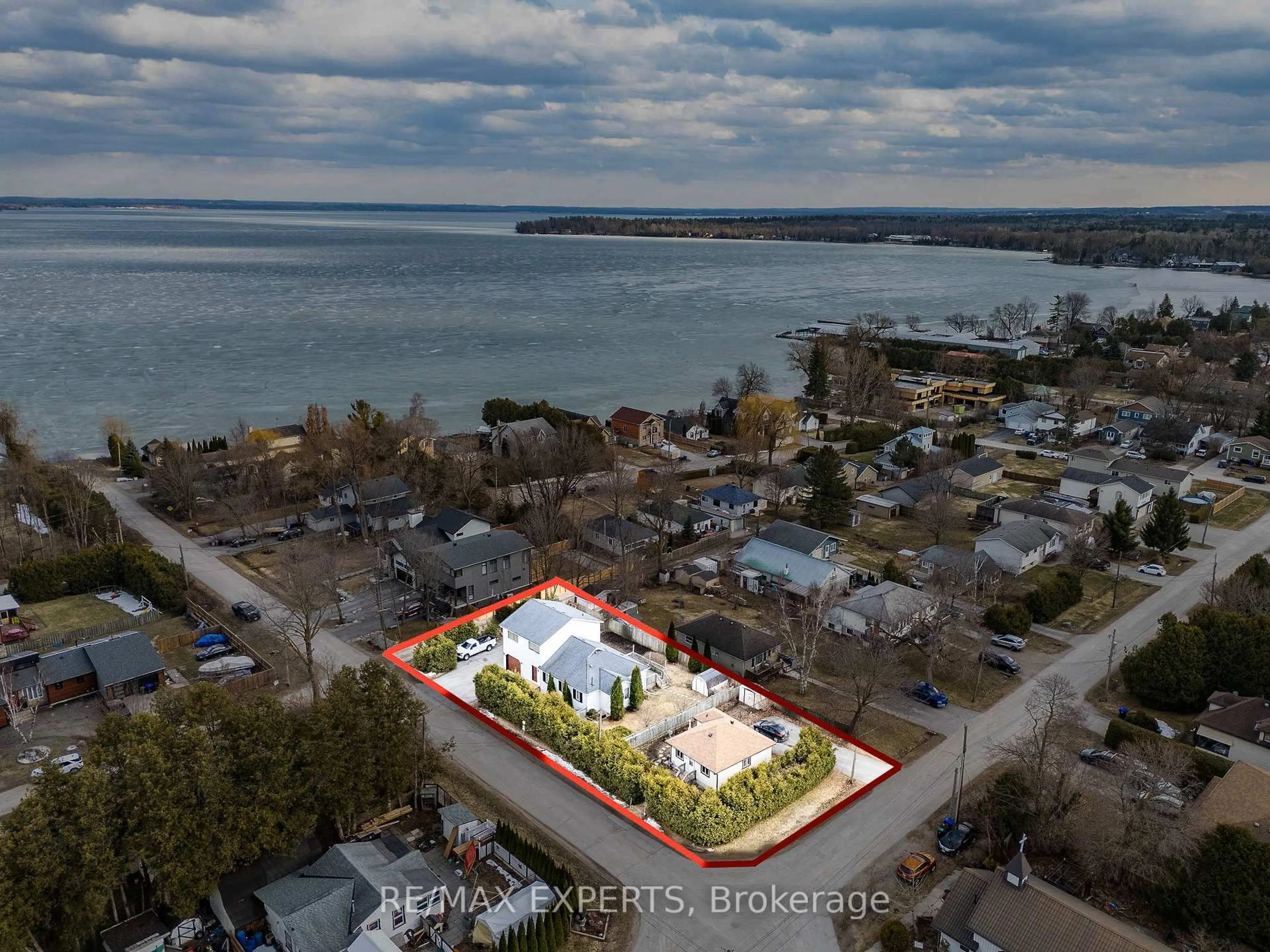 A pic from outside/outdoor area/front of a property/back of a property/a pic from drone, water/lake/river/ocean view for 1004 Robinson St, Innisfil Ontario L0L 1C0
