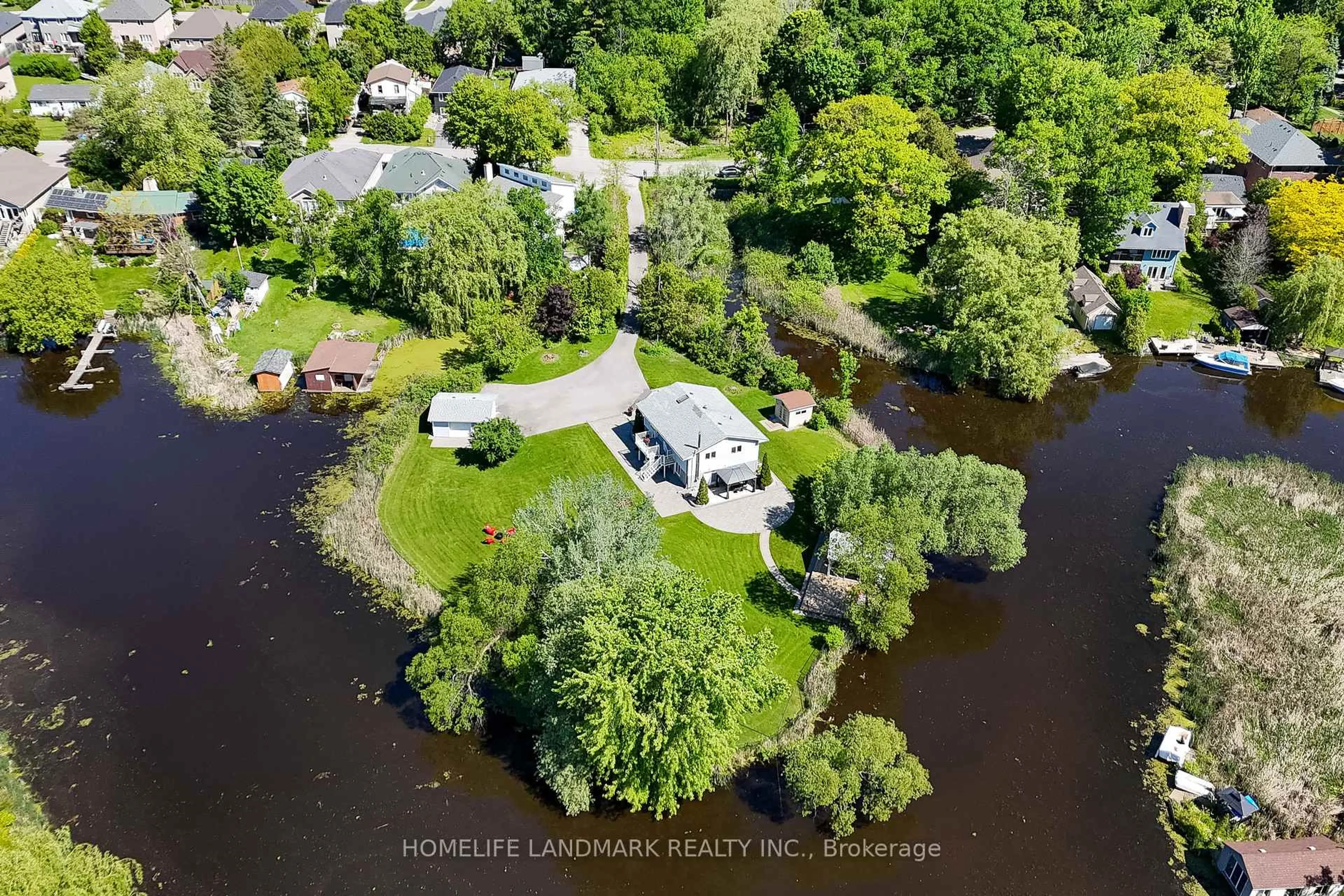 A pic from outside/outdoor area/front of a property/back of a property/a pic from drone, water/lake/river/ocean view for 57 Riveredge Dr, Georgina Ontario L4P 2N8