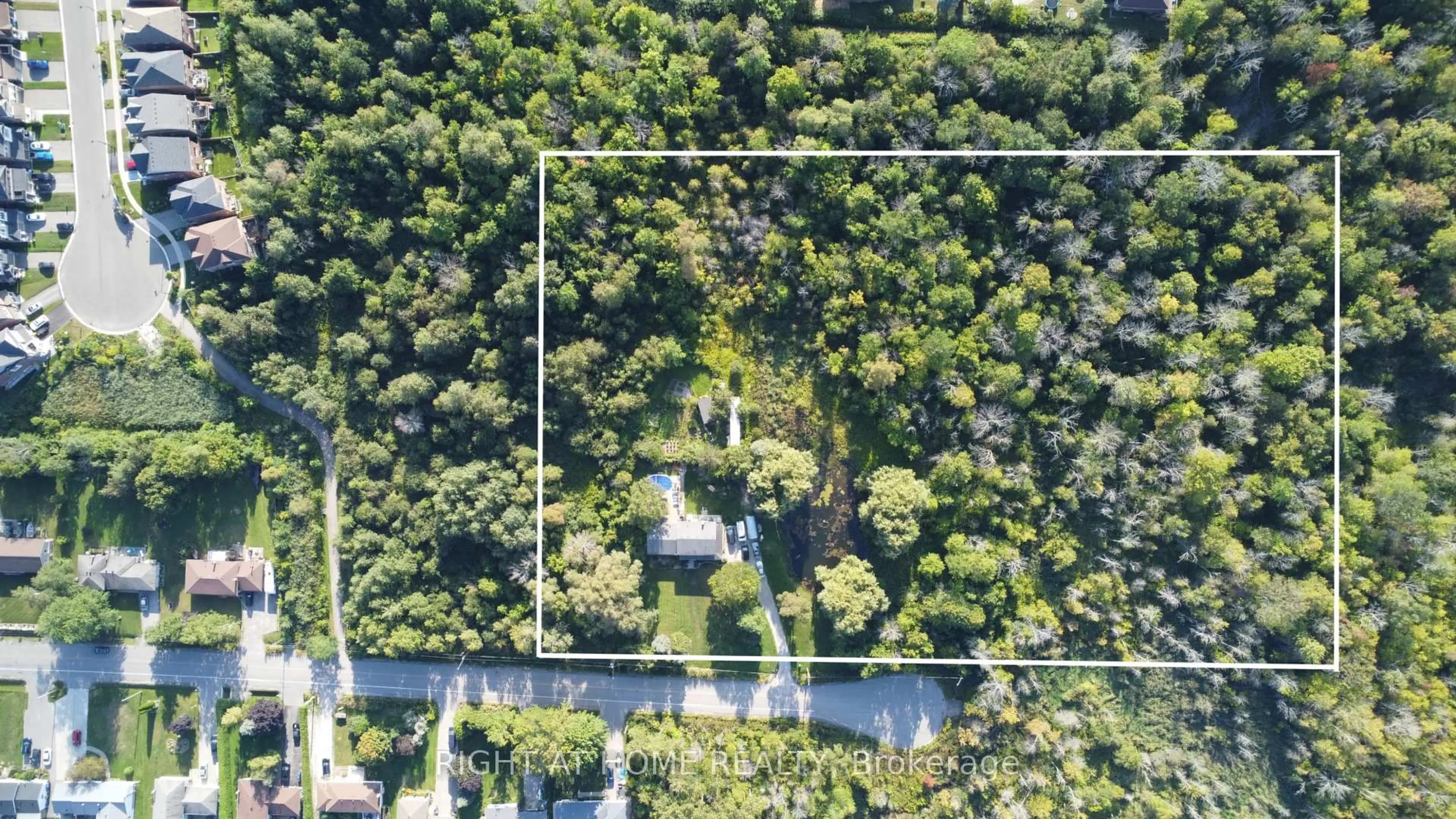 A pic from outside/outdoor area/front of a property/back of a property/a pic from drone, forest/trees view for 2230 Spring St, Innisfil Ontario L9S 2B6