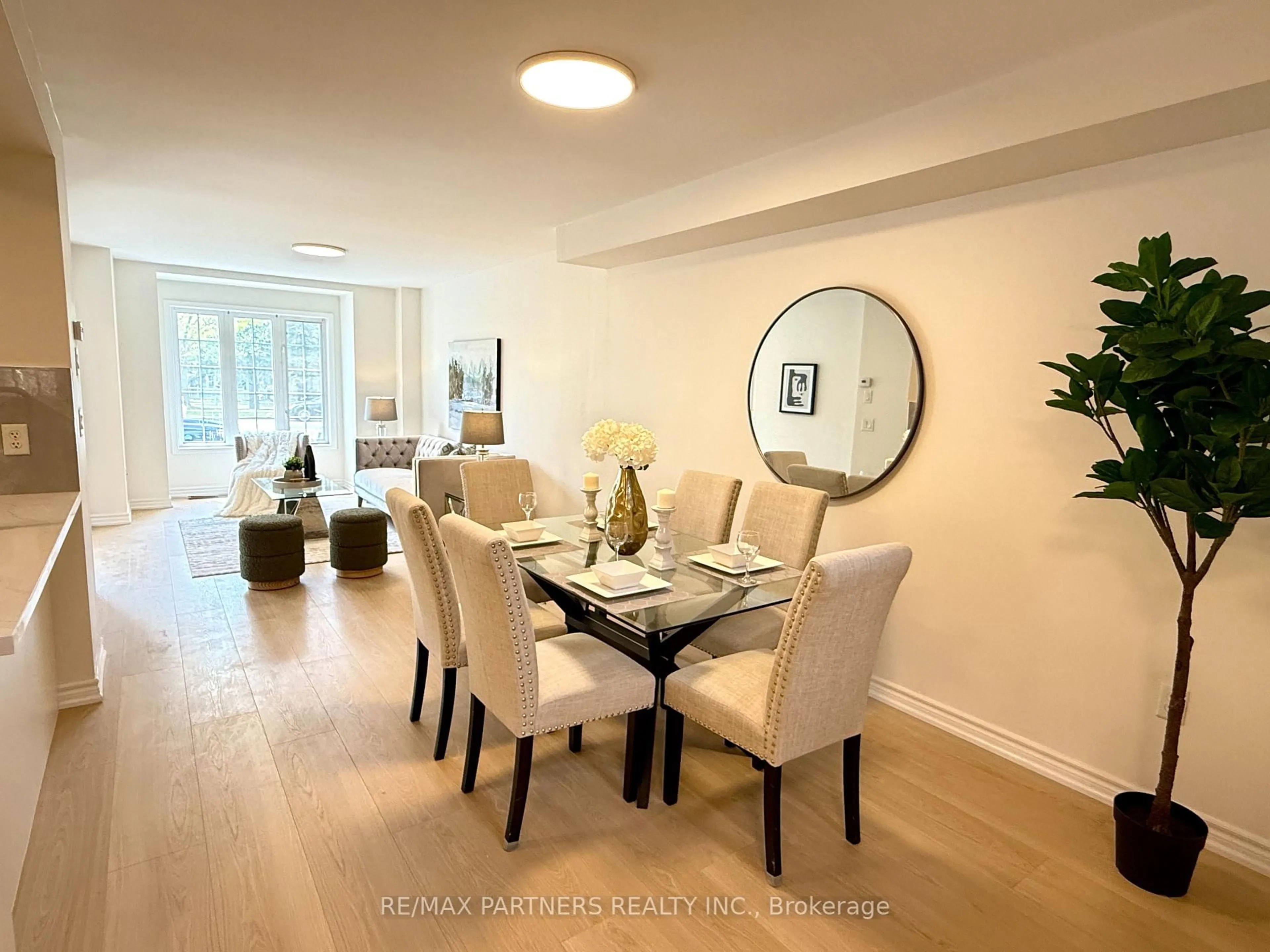 Dining room, wood/laminate floor for 516 Bur Oak Ave, Markham Ontario L6C 3A9